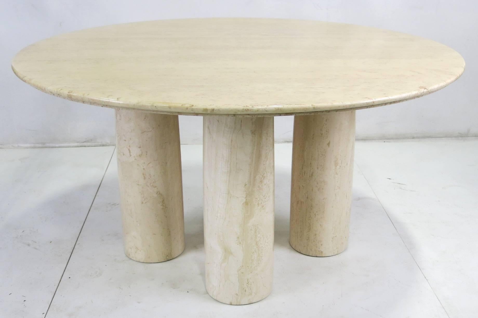Stunning and rare II Colonnato dining table in solid Travertino Romano by Mario Bellini for Cassina, circa 1977. This rare table was only made for a few years, from 1977 through 1980. The Travertine table top with its Ogee edge is raised on five