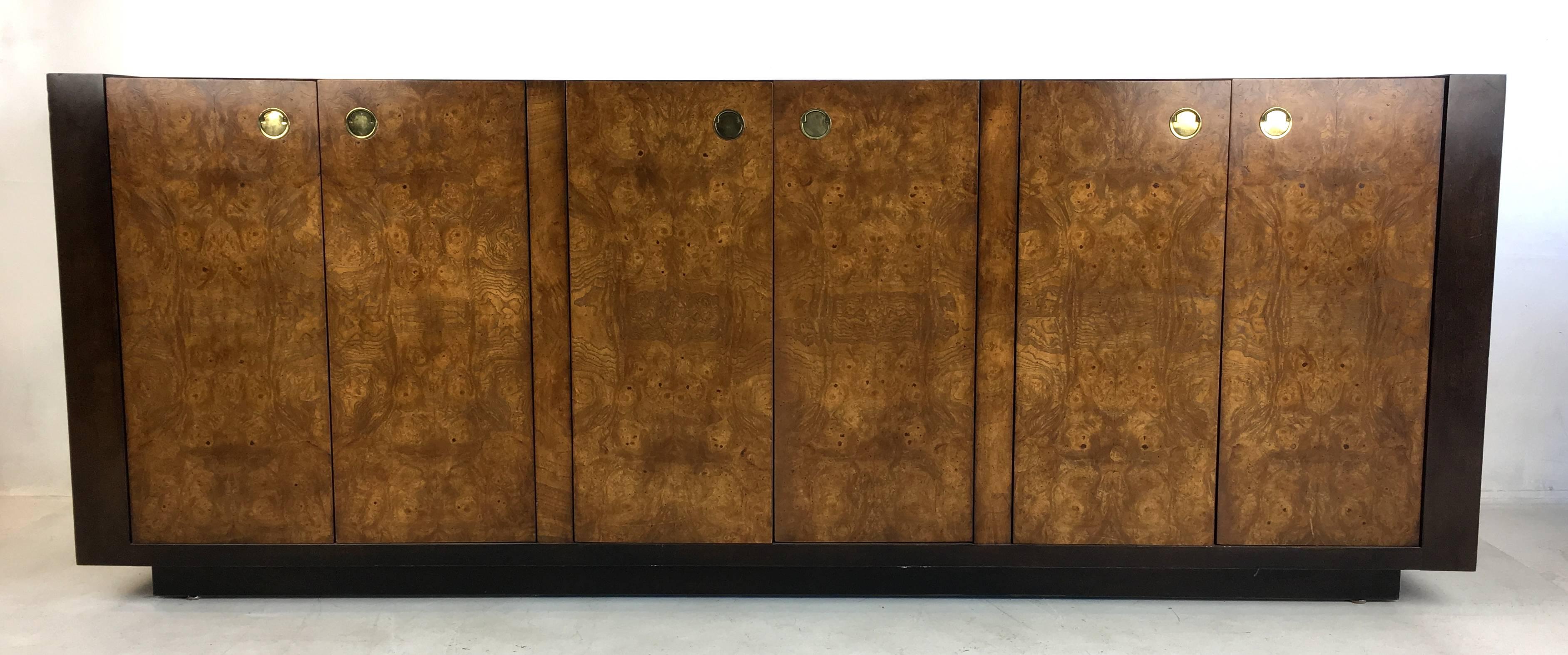Beautifully crafted mahogany buffet with Carpathian elm burl top and doors with flush brass finger pulls evocative of the works of Paul Evans.  The dark brown lacquered Mahogany end panels accentuate the vibrant bookmatched burl veneers.  Top