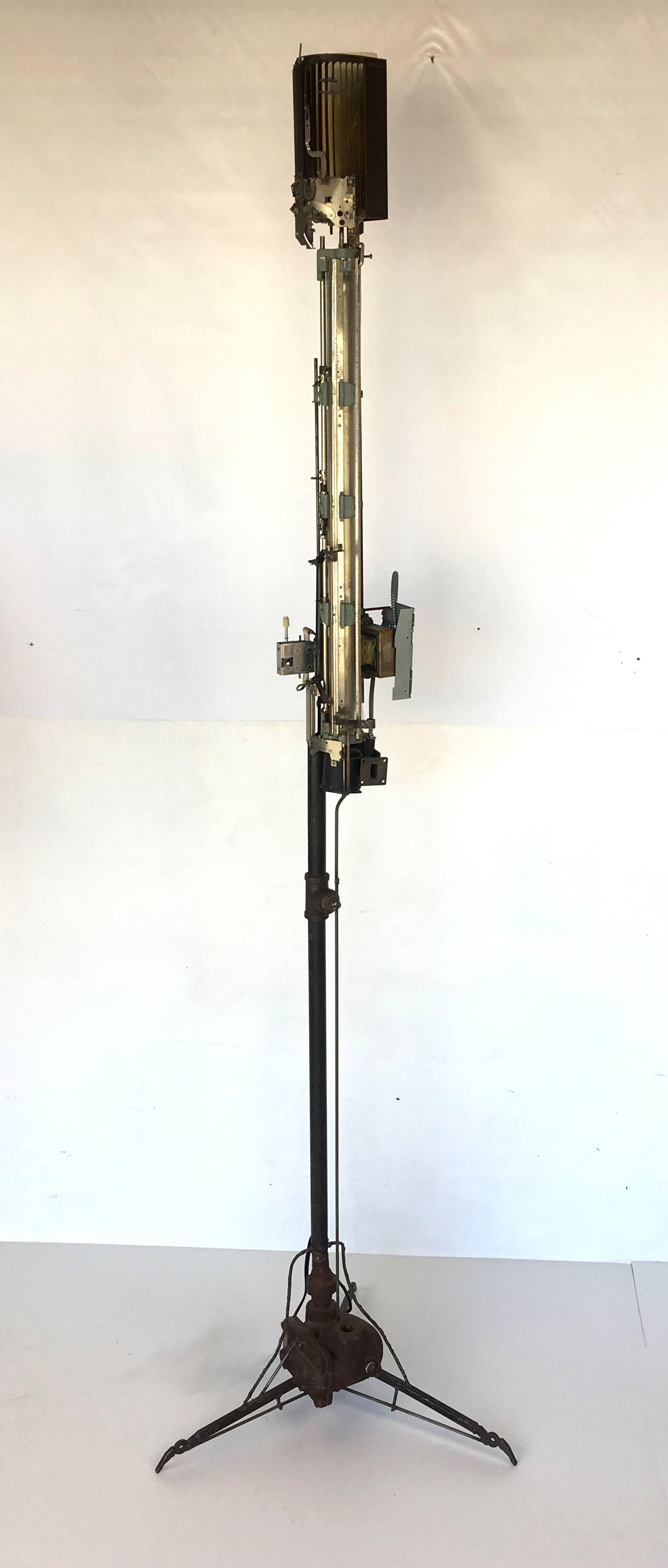 Unbelievable sculptural assemblage of mechanical and electronic parts and hardware forming this beautifully brutal floor lamp. Not only is it a beautiful object, but when it's lit it takes on an entirely different dimension, casting a moody and