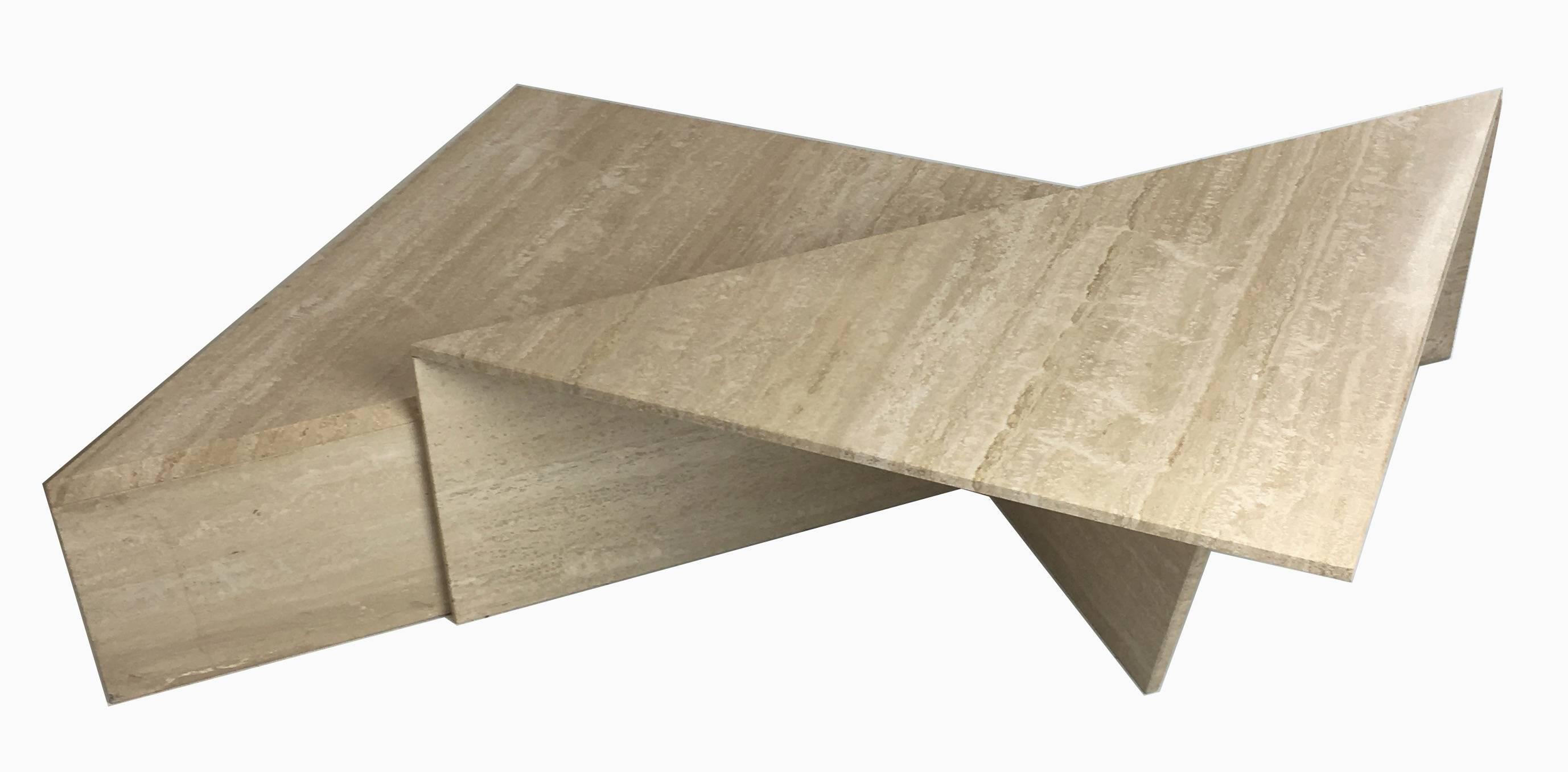 Fantastic Italian large-scale sculptural Travertine coffee table. The two-piece, bi-level cocktail table can be configured in a number of ways to compliment your seating with a super-chic 1970s vibe. All of the corners and joints are mitered and
