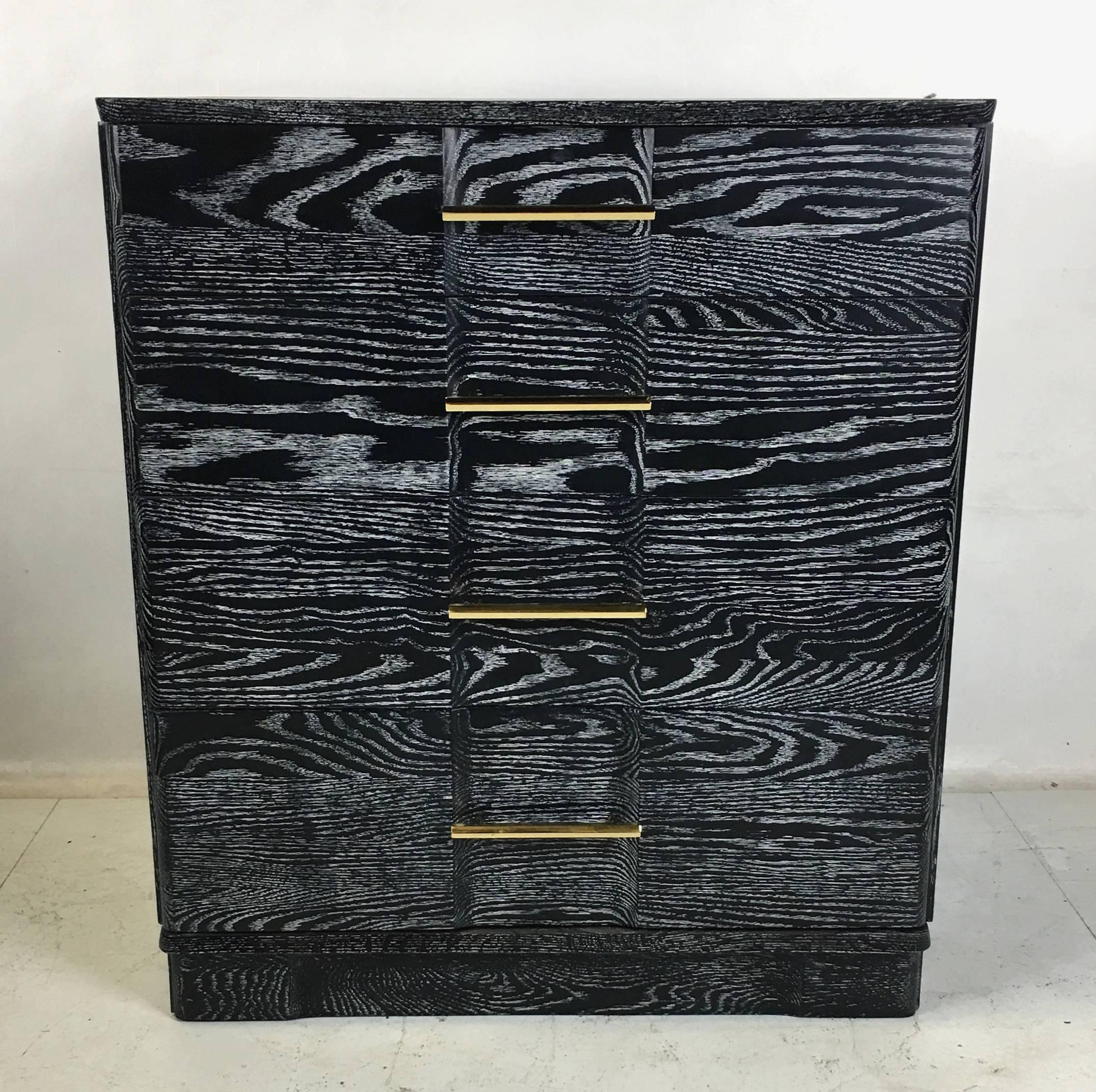 Handsome pair of breakfront chests in ebonized and cerused oak. This fine pair of chest have dovetailed oak drawer boxes that slide beautifully, like the day they were made. Polished Brass pulls. Top quality construction.  All work done with