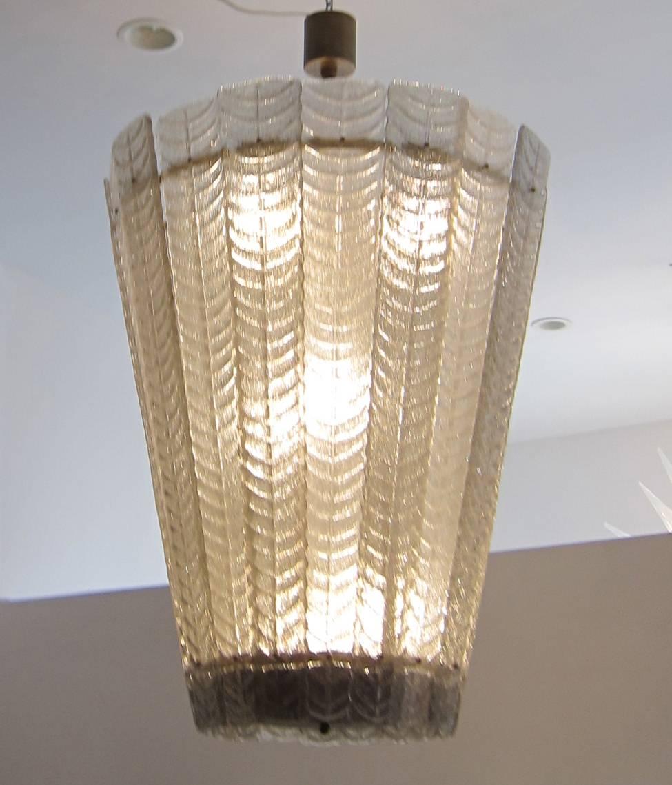 Large Murano glass and brass lantern or chandelier composed of two-tone textured glass. Wired to the US standard.