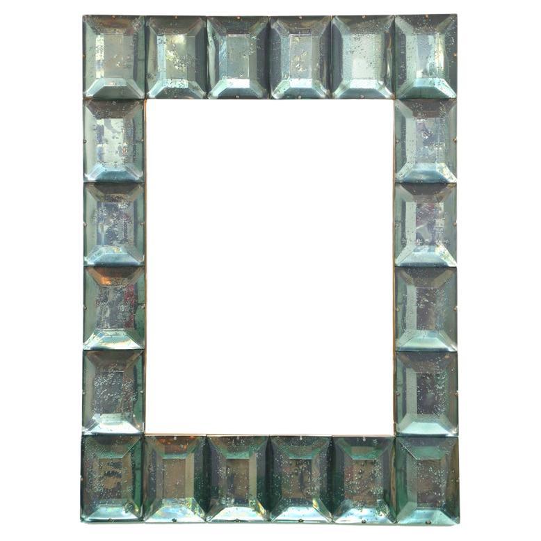  Contemporary diamond Murano glass block mirror, in stock
 Vivid and intense sea green glass block with naturally occurring  air inclusions throughout 
 Highly polished faceted pattern
 Brass gallery
 Luxury handcrafted by a team of artisans in