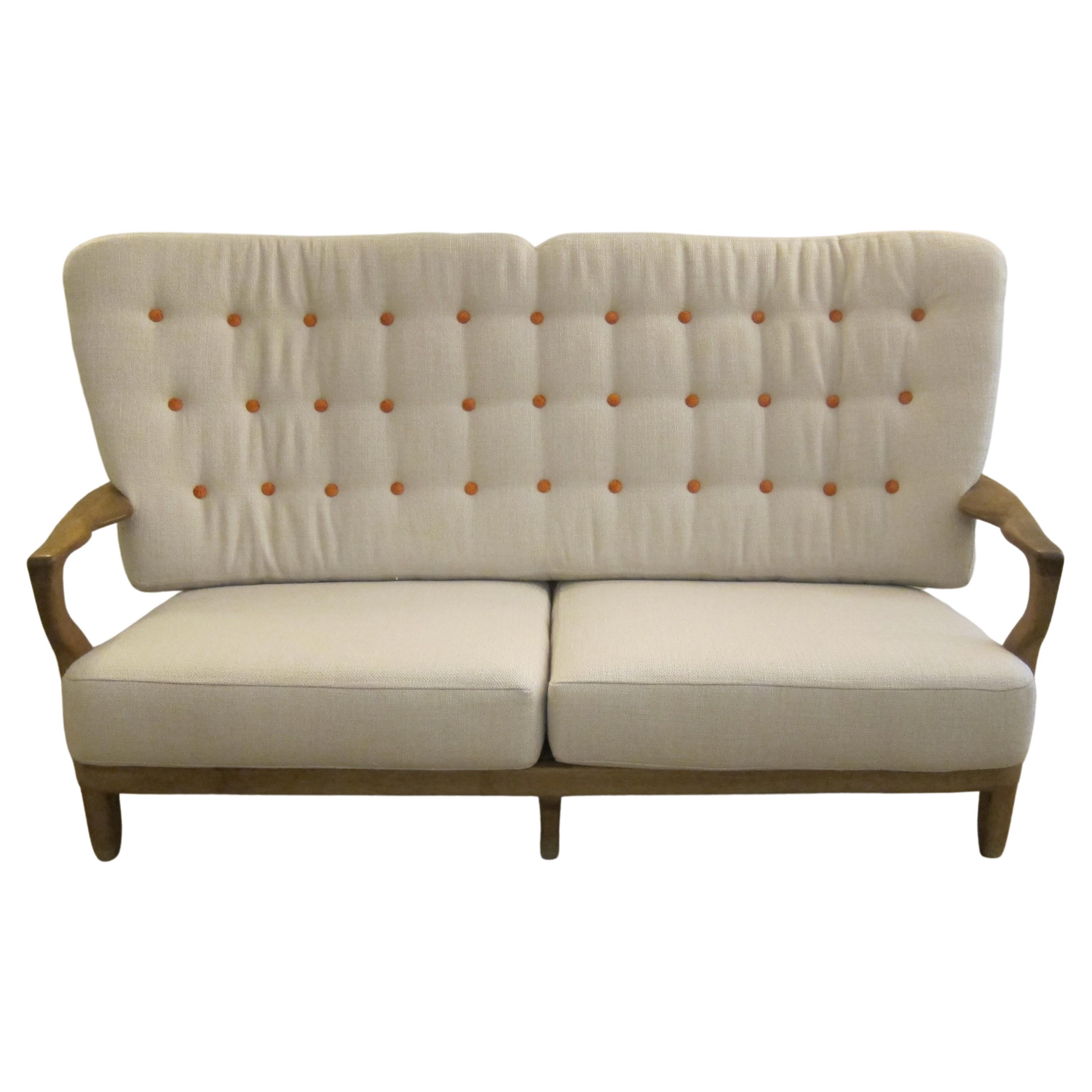 Mid-Century modern oak settee by Guillerme et Chambron, France 1950.
 Organically shaped, clean-lined and elegantly simple with iconic finger back.
Retains a beautiful warm patina.
Newly upholstered
Available to view in situ in our Miami gallery

 
