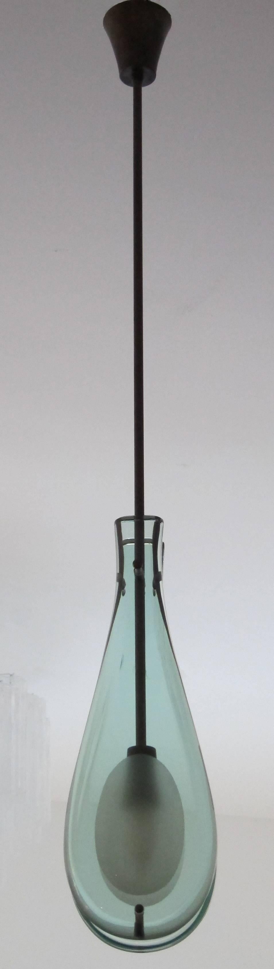 Fontana Arte modern light green glass water drop pendant with patinated brass structure and fittings,  
Located in our store in Miami ready for shipping.
