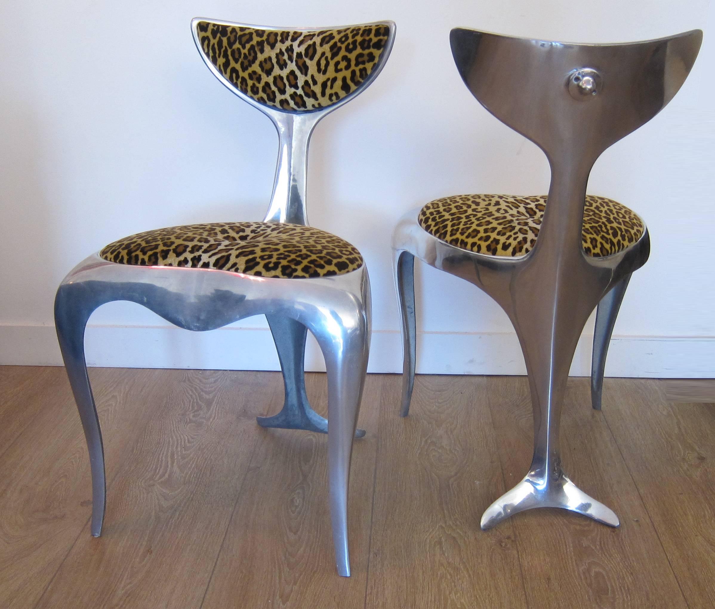 Pair of polished aluminum dolphin tail chairs by Mark Brazier-Jones.
Signed and numbered 41/300 and 44/300, 1994.