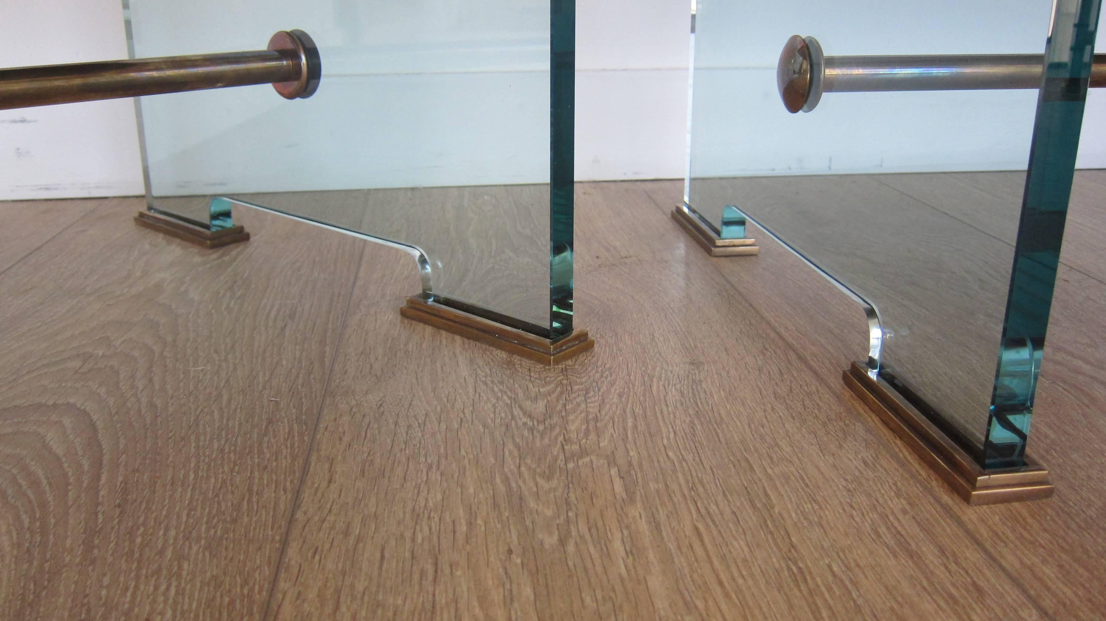  Pair of studio-built stools. Bronze and glass with red leather upholstery.