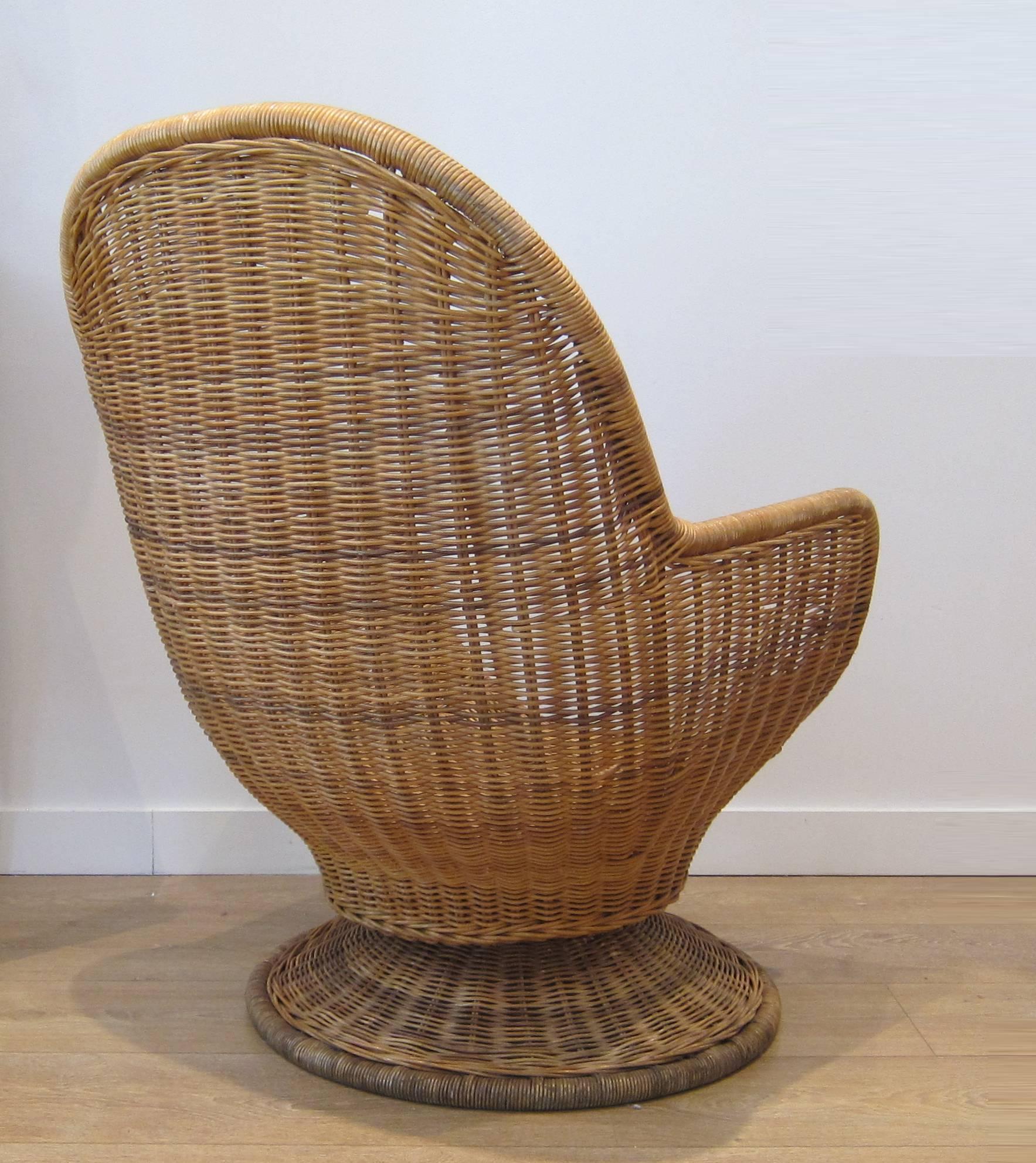 Amazing pair of large egg shape rattan chairs. They feature both swivel and tilt functions. Sold as is (no pads or upholstery.) Chairs are well constructed.