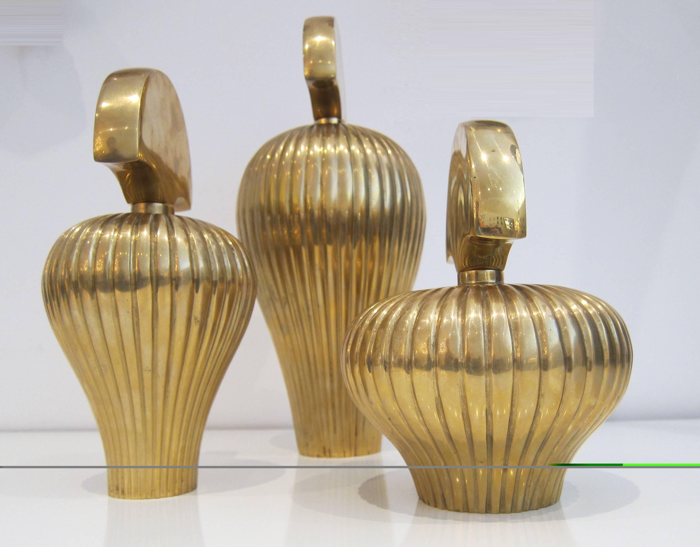 Elegant set of three solid brass decorative perfume bottles. Bottles are unmarked, sizes are 13