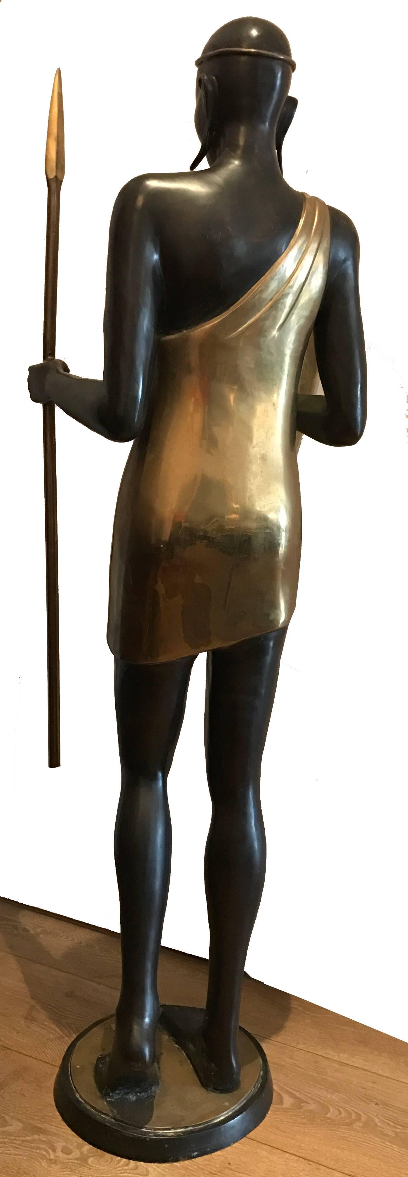 Vintage life-size bronze and brass sculpture of an African male warrior in Hagenauer Style.

