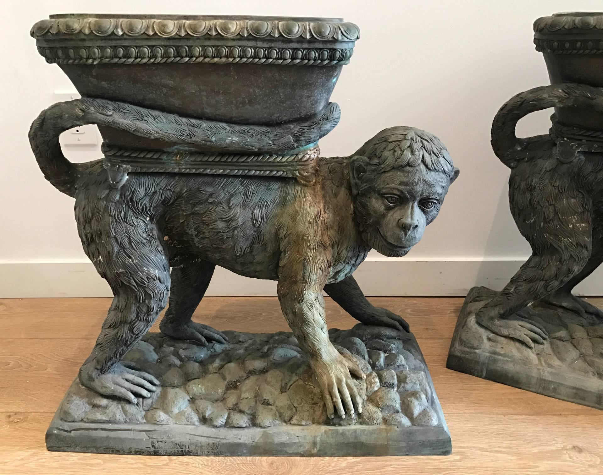 Whimsical pair of cast bronze planters with beautiful verdigris patina consistent with age and use.