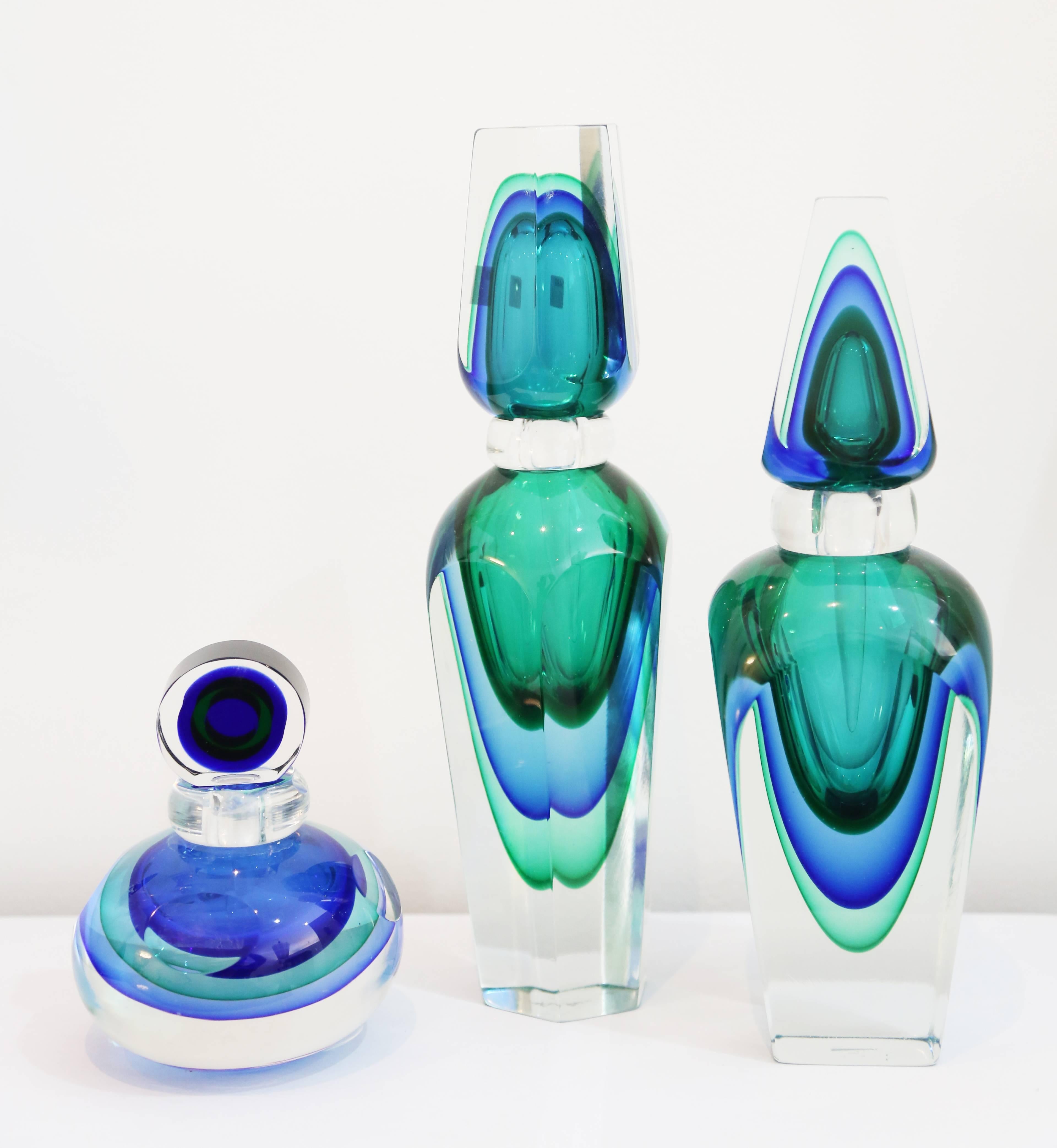 Group of three Murano glass perfume bottles. Very thick glass and great colors.
Measures: 11