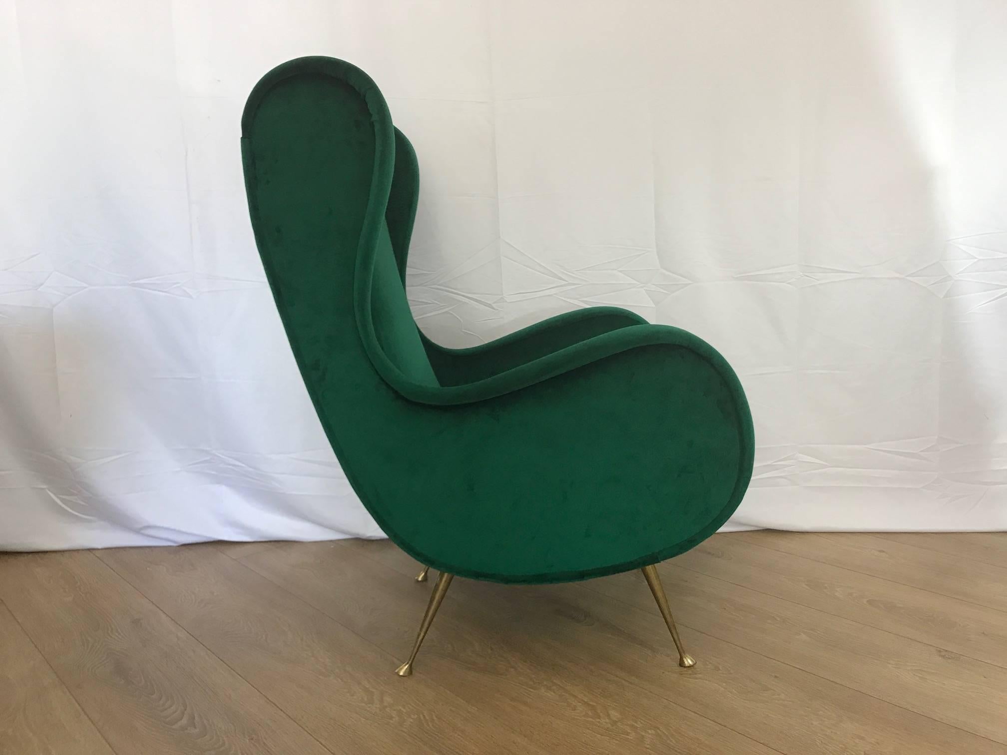 Single Italian lounge chair, brass legs and newly upholstered with green velvet.