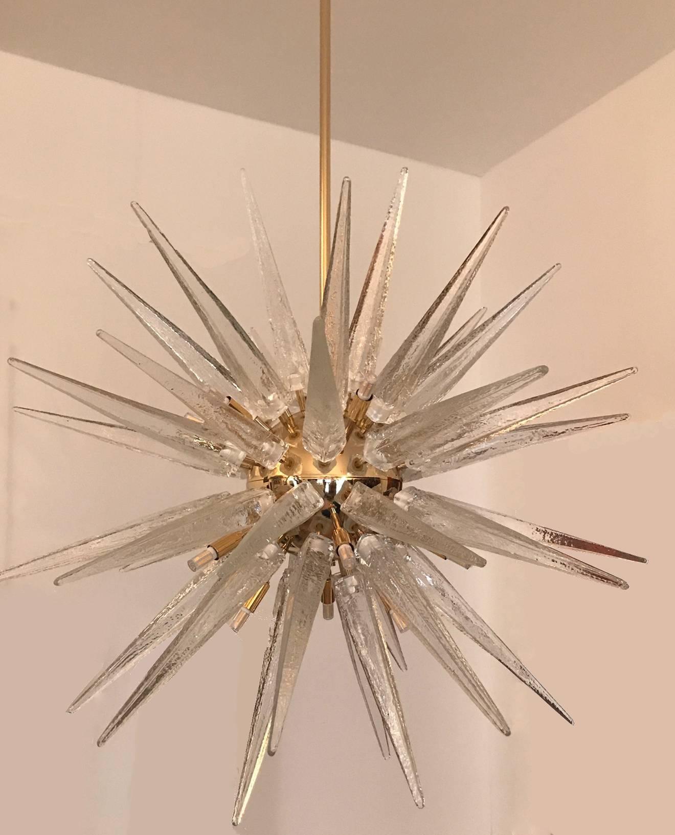 Gold plated sputnik chandelier with hand blown Murano glass spikes.
18 G9 exposed lights, with 50 glass spikes on stems.
 Please note that length of stem can be adjusted for a shorter overall height.
