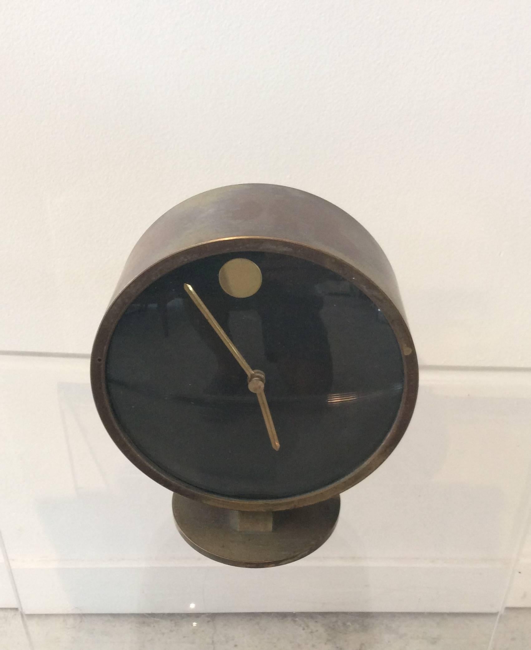 You are looking at a super chic brass table clock designed by Nathan George Horwitt for the Howard Miller clock company which made most of George Nelsons clocks. This clock in particular is known as the museum clock and is the table version.
