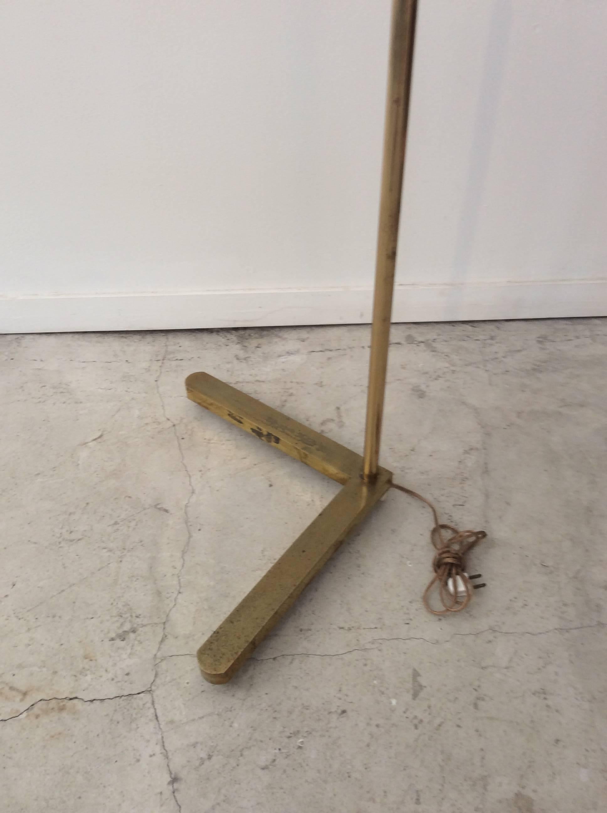 Your looking at a solid brass adjustable floor lamp made by Casella. The base is 