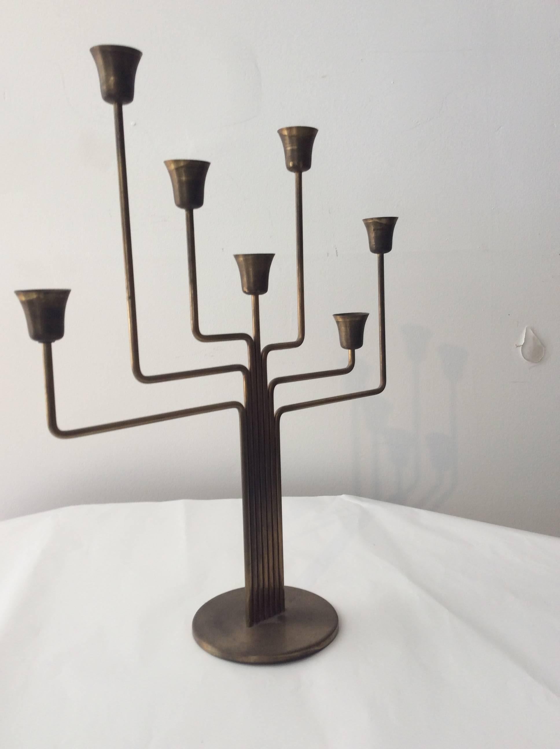 You are looking at a vintage Scandinavian brass candelabra designed by either Svend Aage or Kasper Schultz for Holm Sorensen. This candelabra is similar to Piet Heins design. The brass has acquired a wonderful patina with age. Candelabra is signed