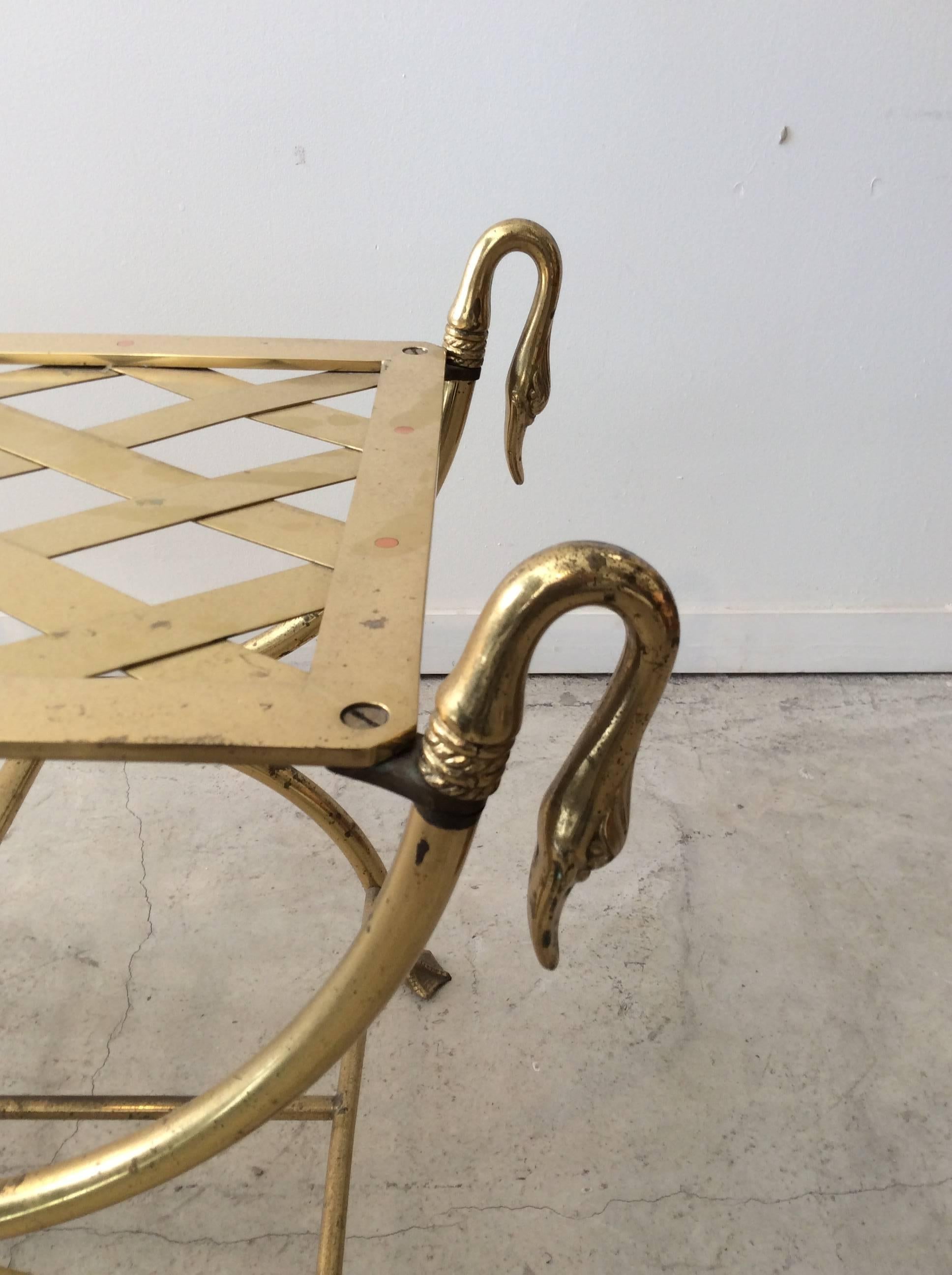 You are looking at a very high quality Italian brass bench with swan detailing on the armrest and on the feet. I've seen this bench as Maison Jansen but I don't know. This bench is all brass with very high detailing to the swan parts. This piece