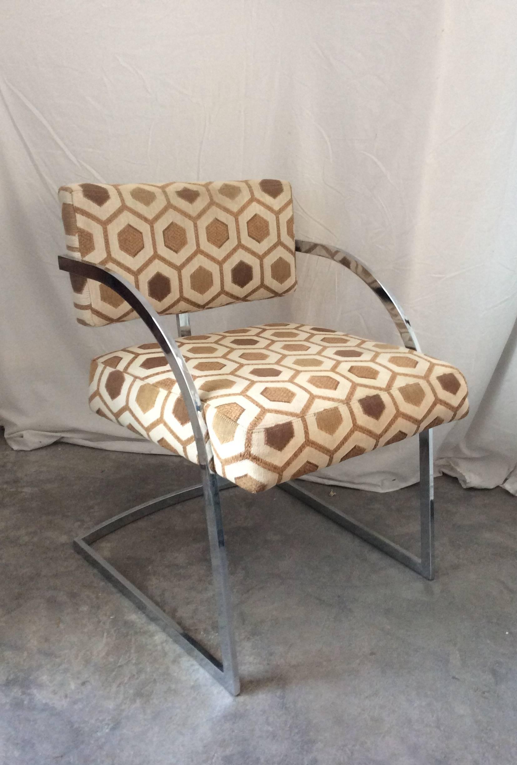 You are looking at a set of four dining chairs manufactured by Thayer Coggin and designed by Milo Baughman. These chairs are in all original condition and for the most part in really good shape. The fabric has a cool embroidered geometric design in