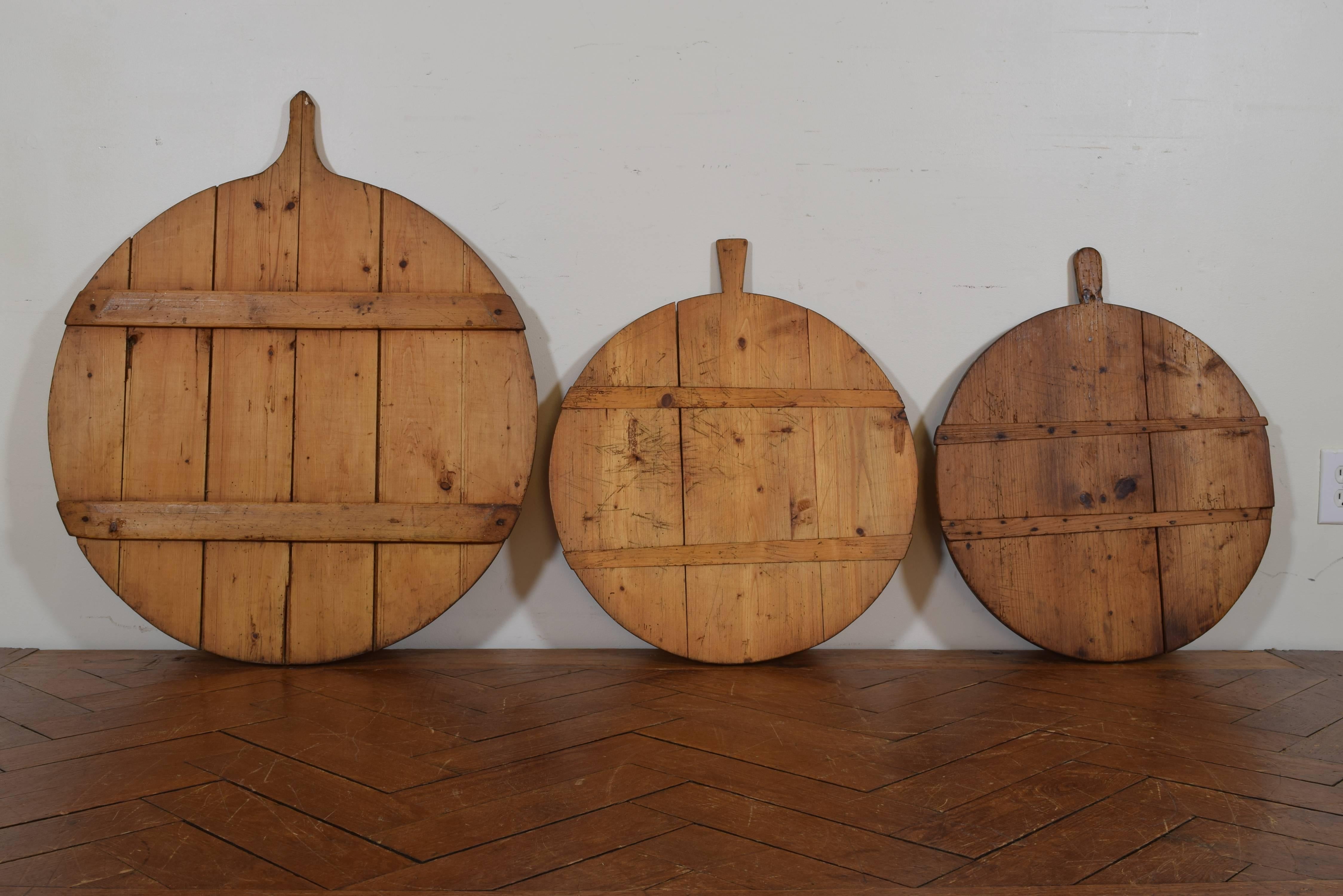 Three hand-carved cutting boards from early 20th century.