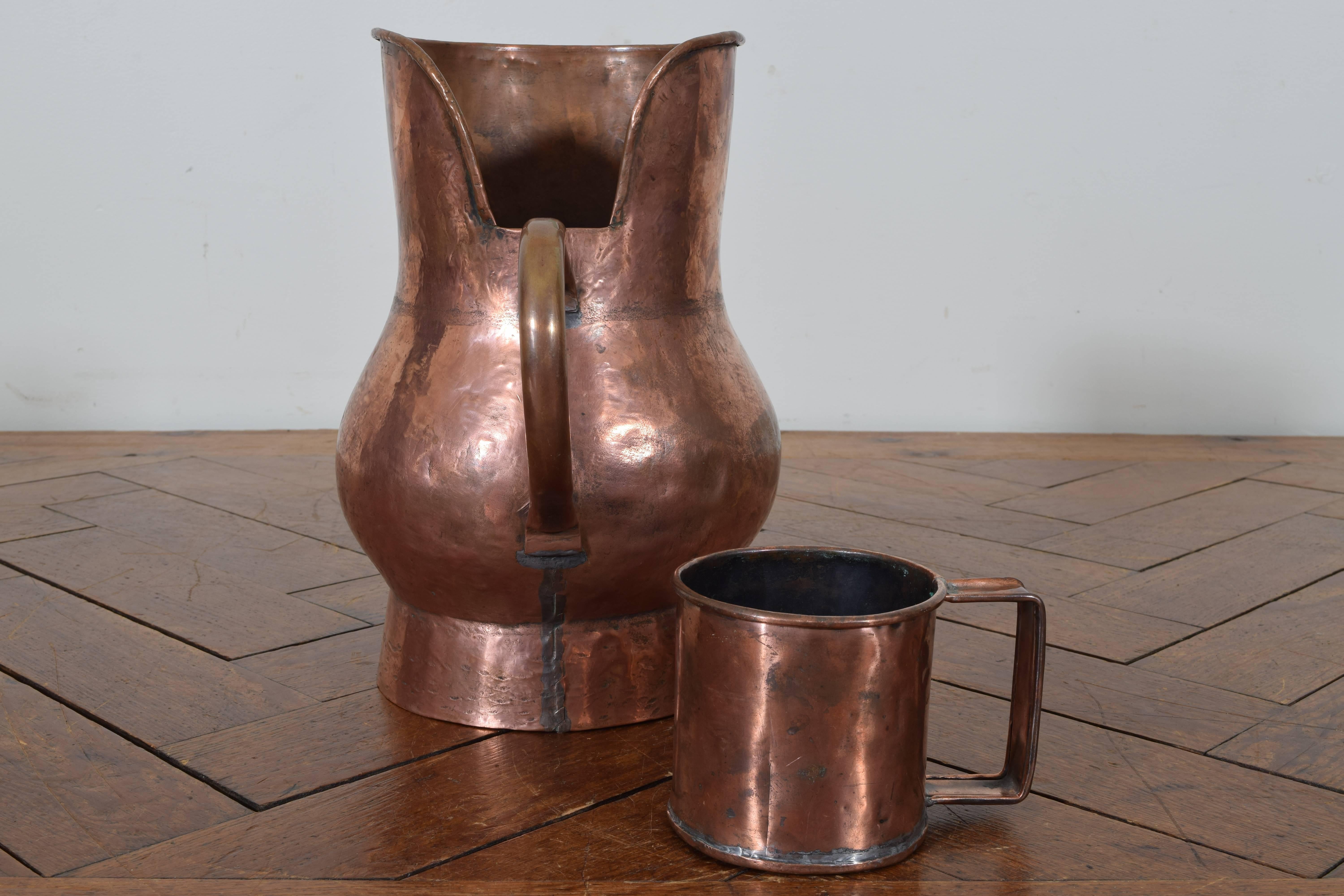 Handled pitcher with line detail accompanied by a similarly styled mug.