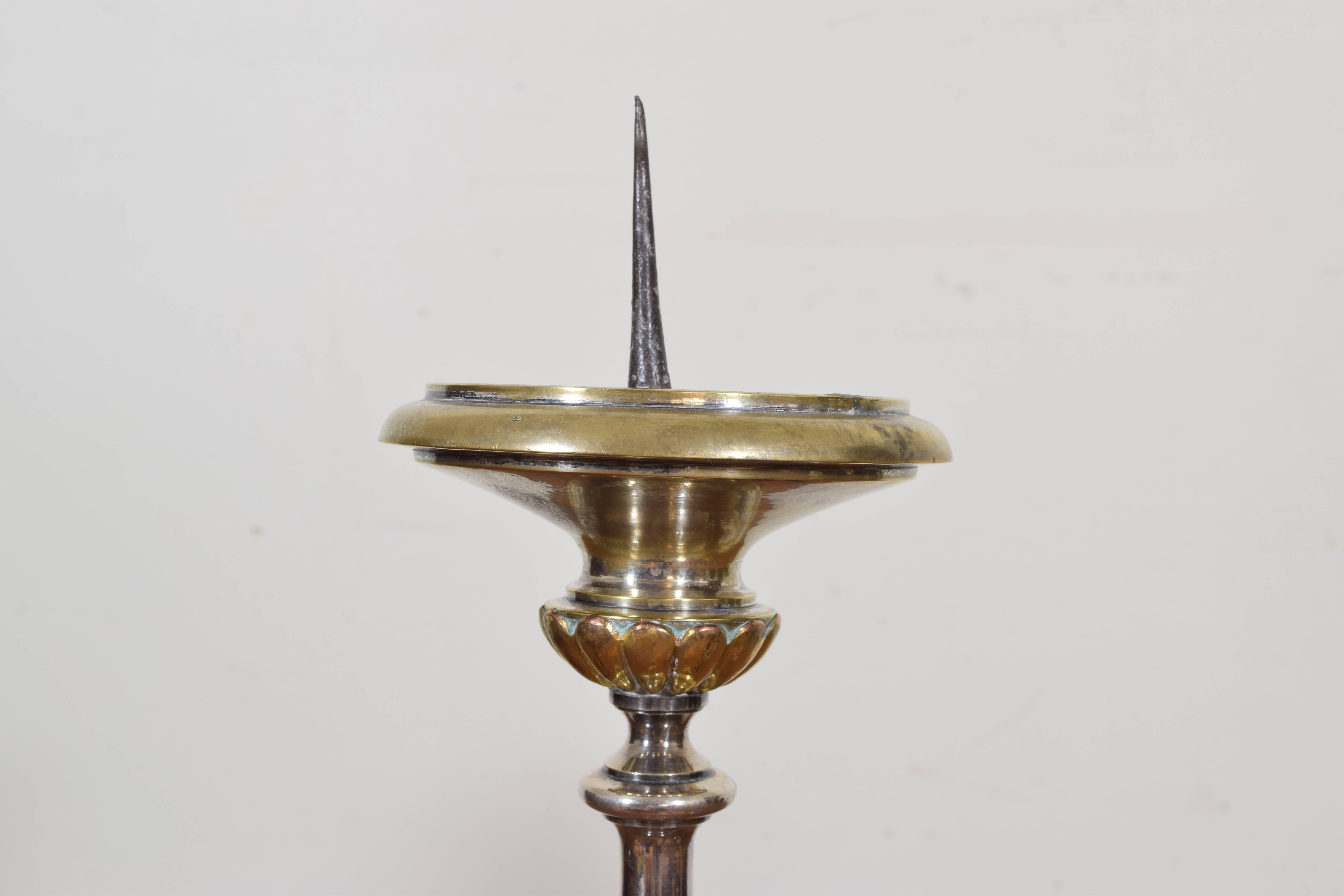 Constructed in parts of brass and silvered brass, heavy with substantial bases, raised on ball feet