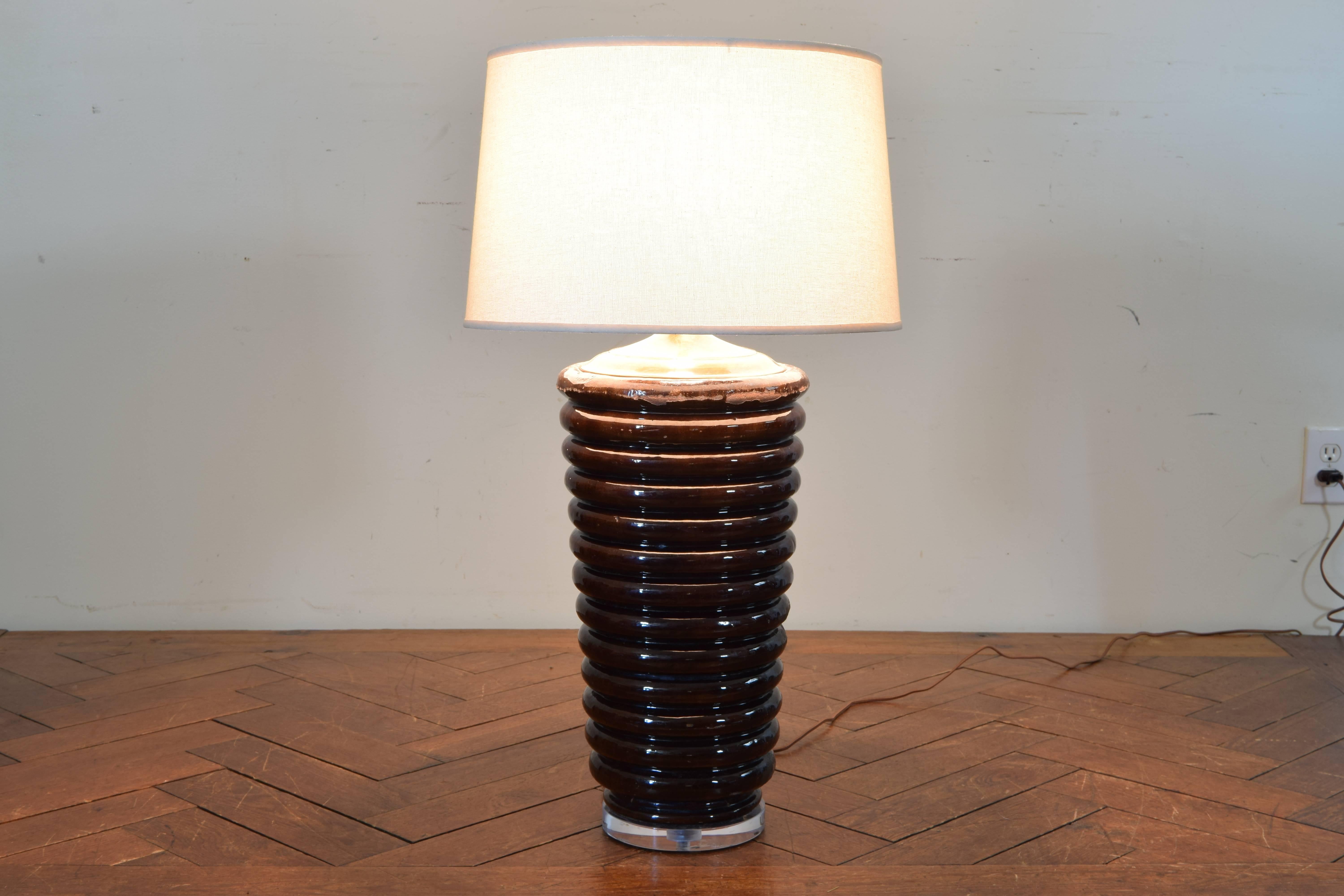 Italian, large glazed terracotta decorative vase mounted as a table lamp, 19th century. Mounted on a Lucite base.
