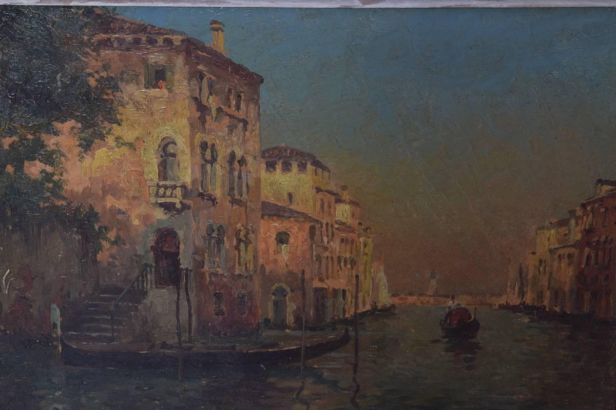 In excellent condition, depicting a gondolier in the near distance rowing toward viewer, the Campanile di San Marco in the far distance, signed H. Henri lower left, in an early 20th century white painted frame.