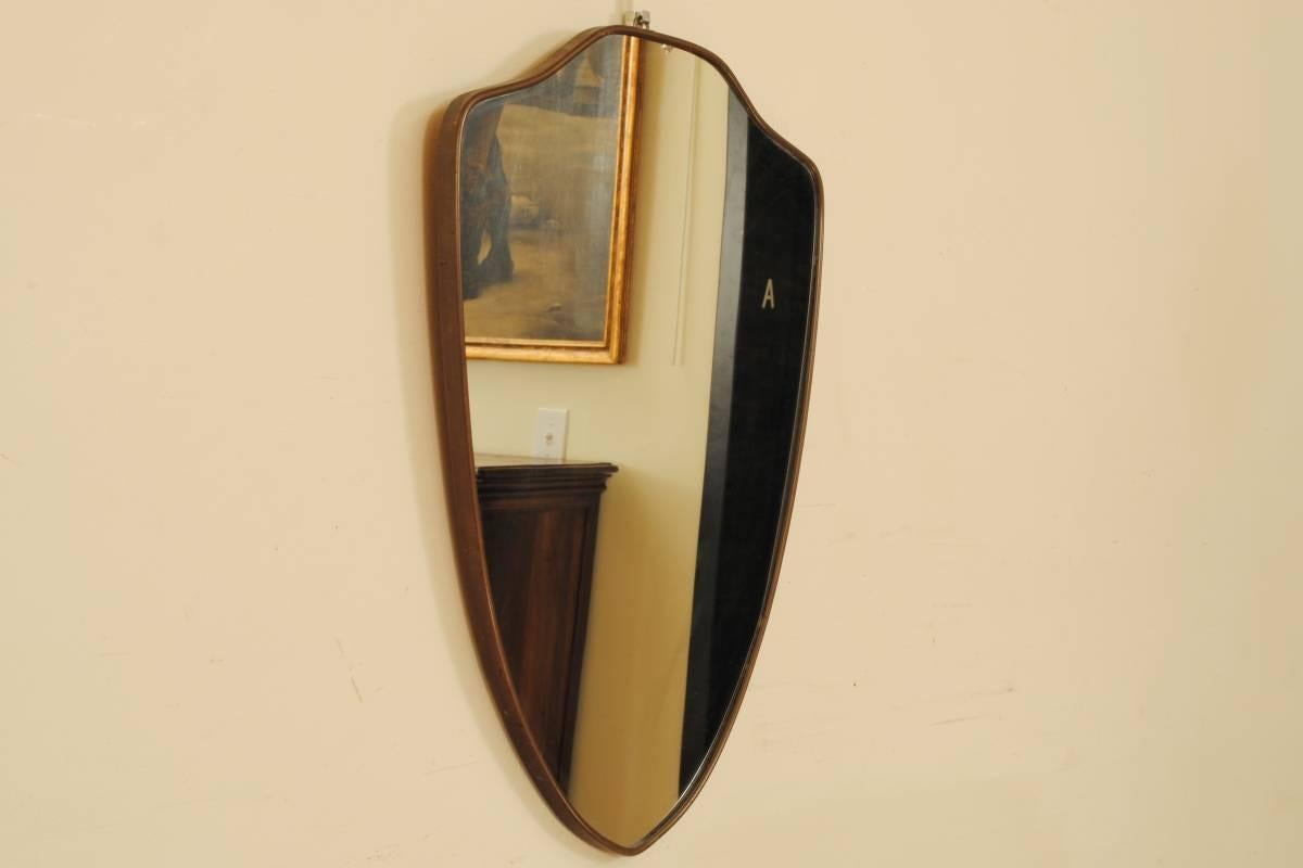 Patinated brass frame, wooden back, 0.25 inch thick mirror plate.
