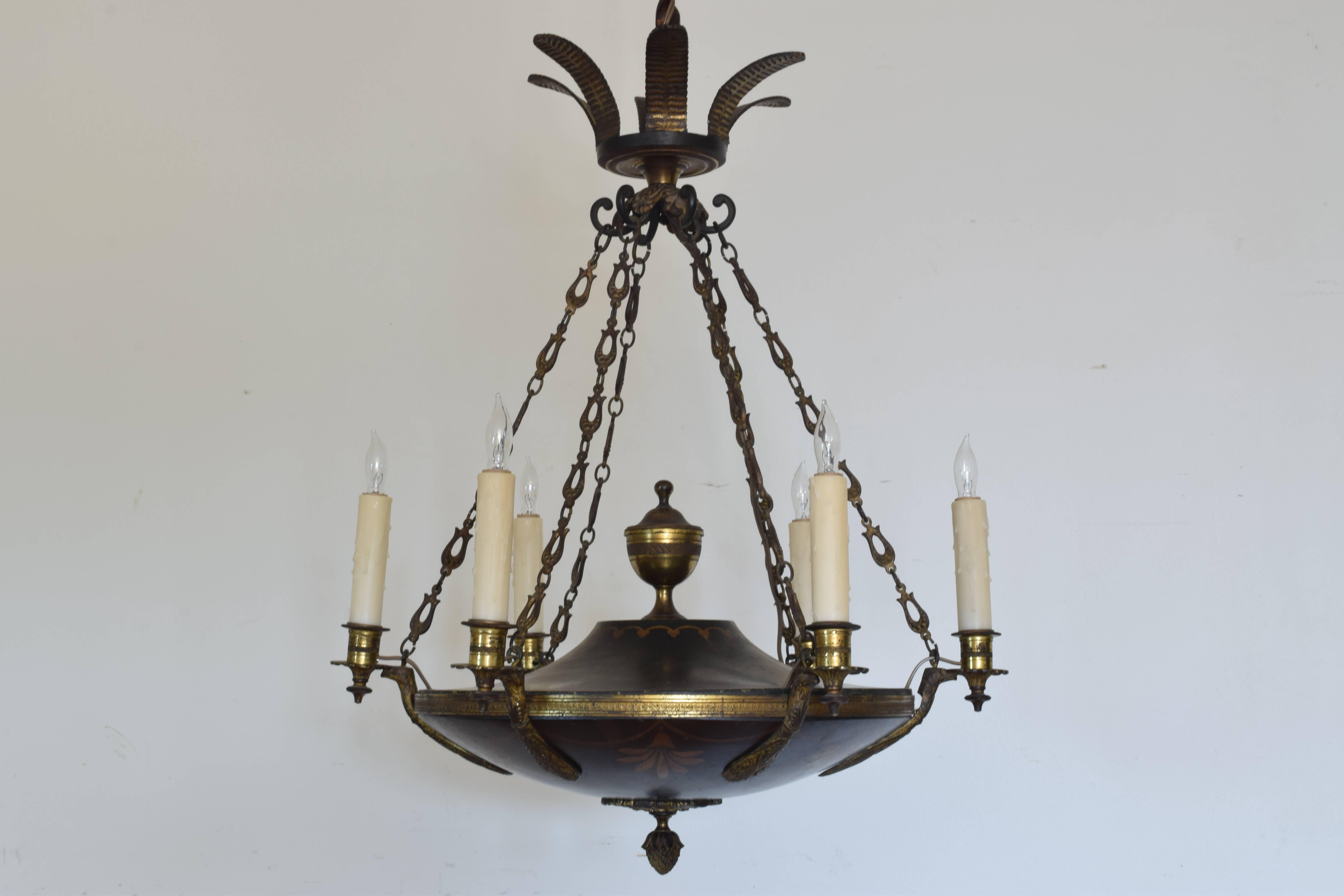 Cast, painted and gilded metal in the Empire style. The main body a flattened urn, painted and with gilt decoration, issuing six cast brass arms. Hanging from original chain and leaf-form canopy.  UL wired.