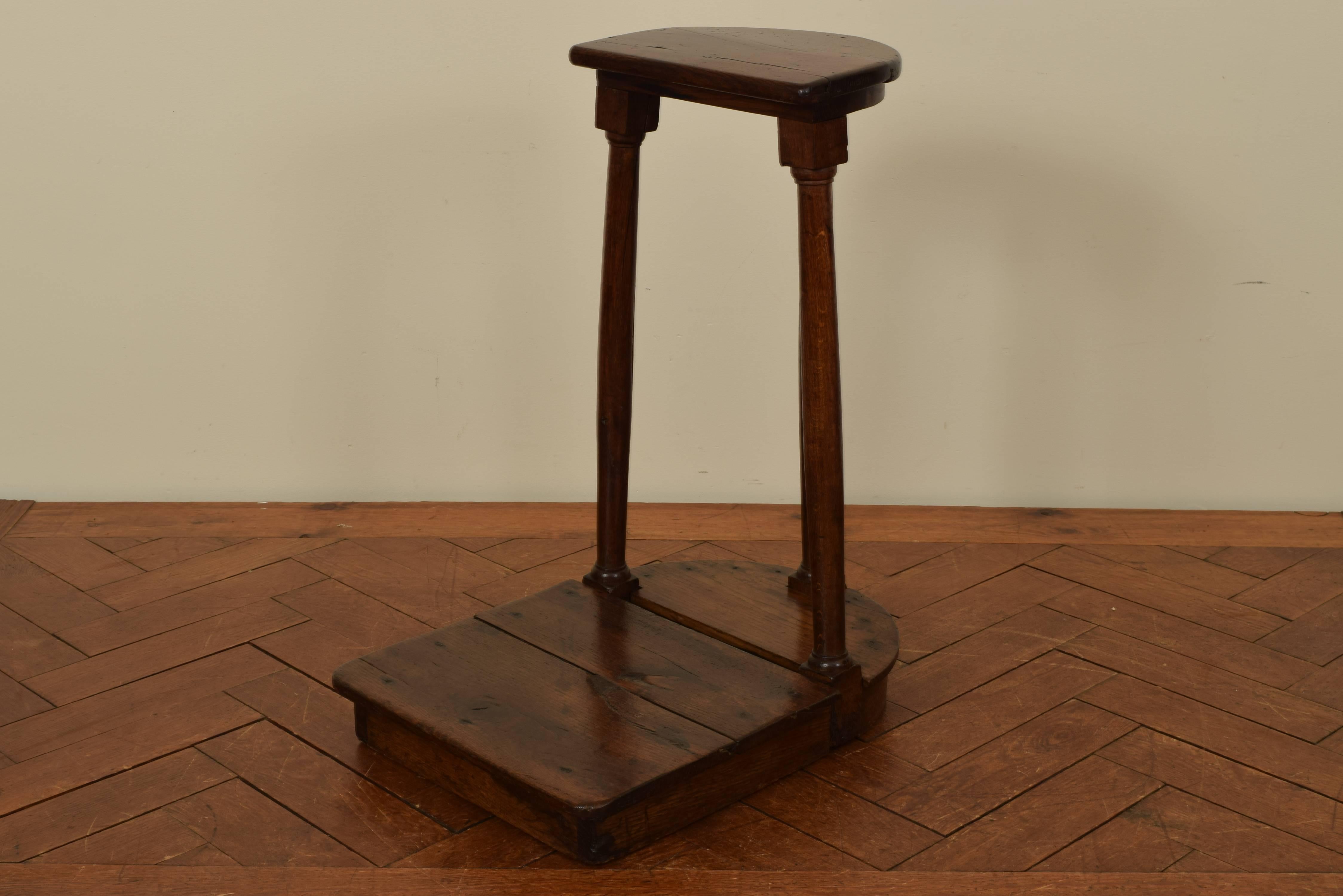 This table was used both for the clergy to privately sit while delivering sermons and by altar boys to stand upon, the demilune top or seat raised on turned supports with blocks at top and bottom, the bottom section known as a dias.