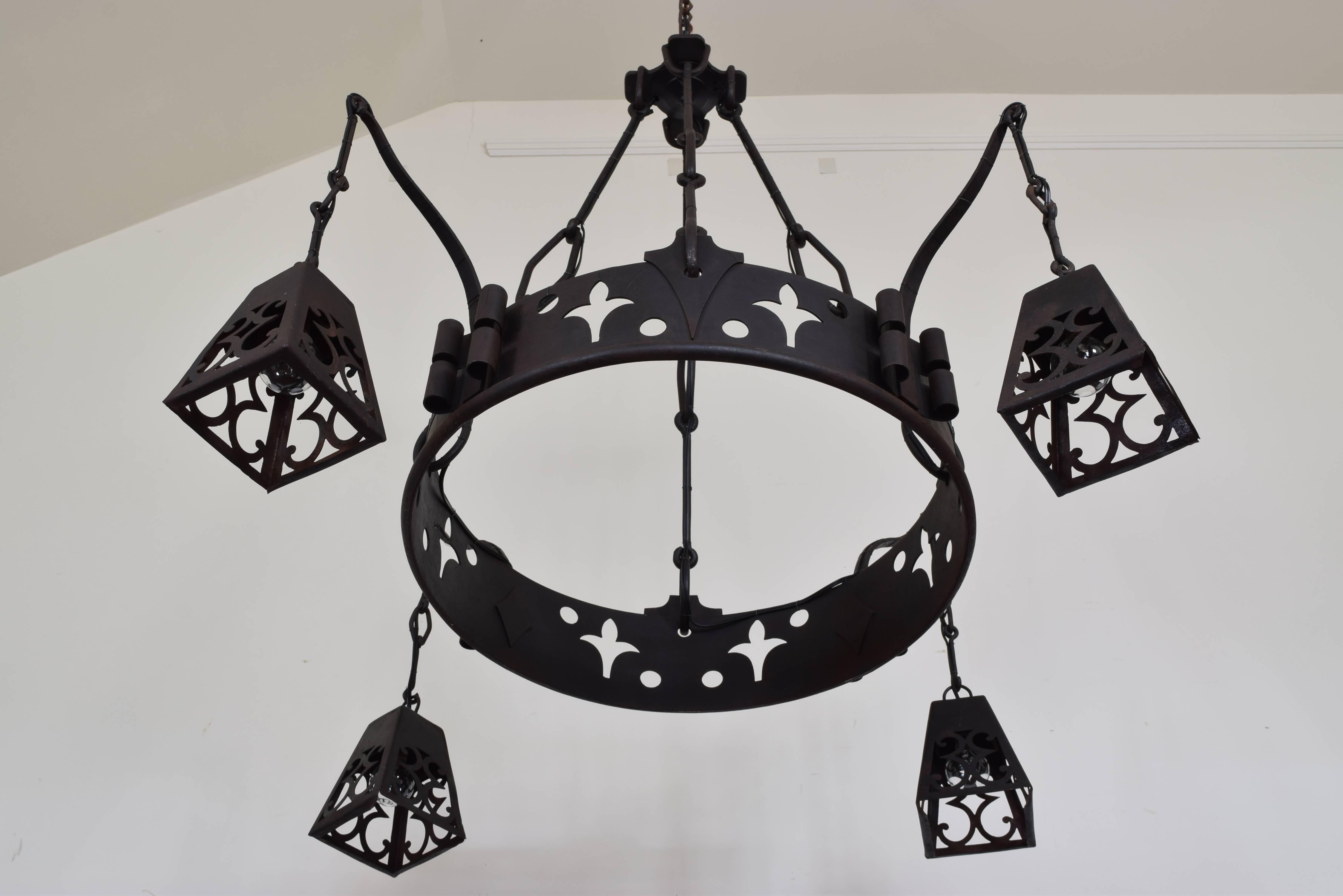 UL wired, beautifully wrought and cast iron pierced ring-form chandelier hanging from shaped rods, the lanterns with pierced decorations, signed J.Guillot from Panissieres, Loire, France.