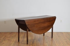 French Early Neoclassic Walnut Circular Gateleg Table, early 19th century