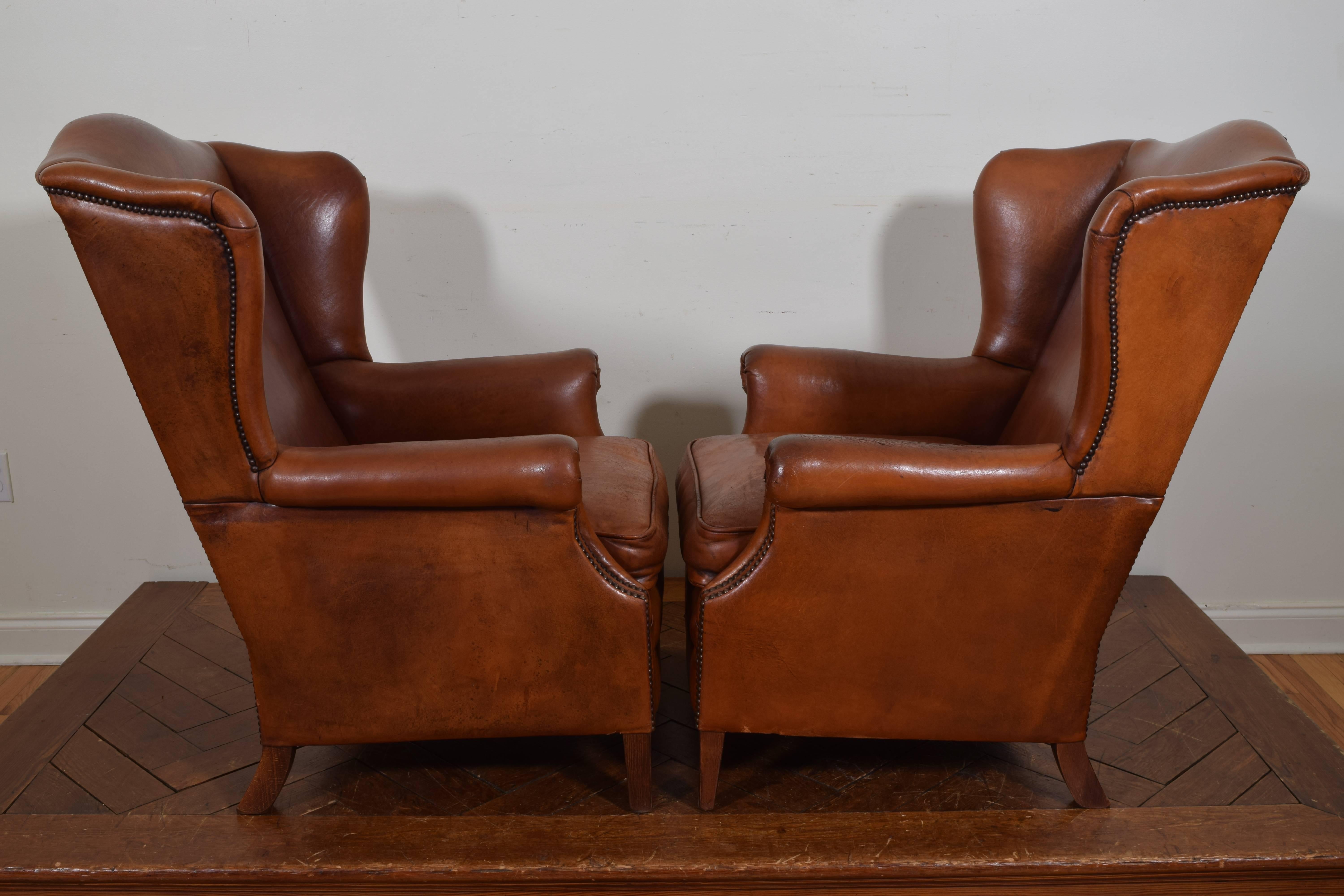 Mid-20th Century French Pair of Chestnut Leather Wing Chairs, Second Quarter of the 20th Century