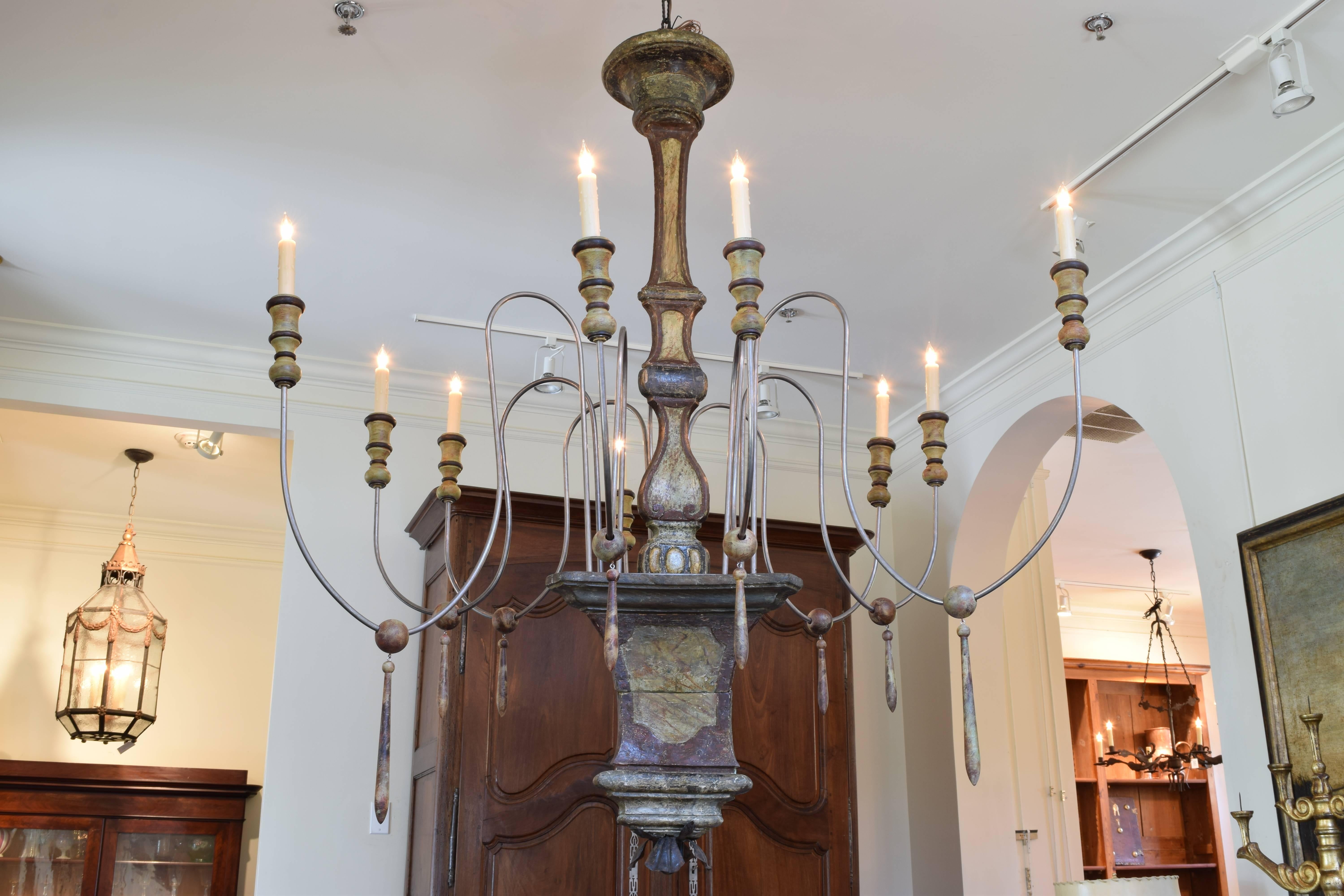 Constructed from a mid-18th century faux marble painted torchere, the new arms with painted bobeches and tassels, UL wired.