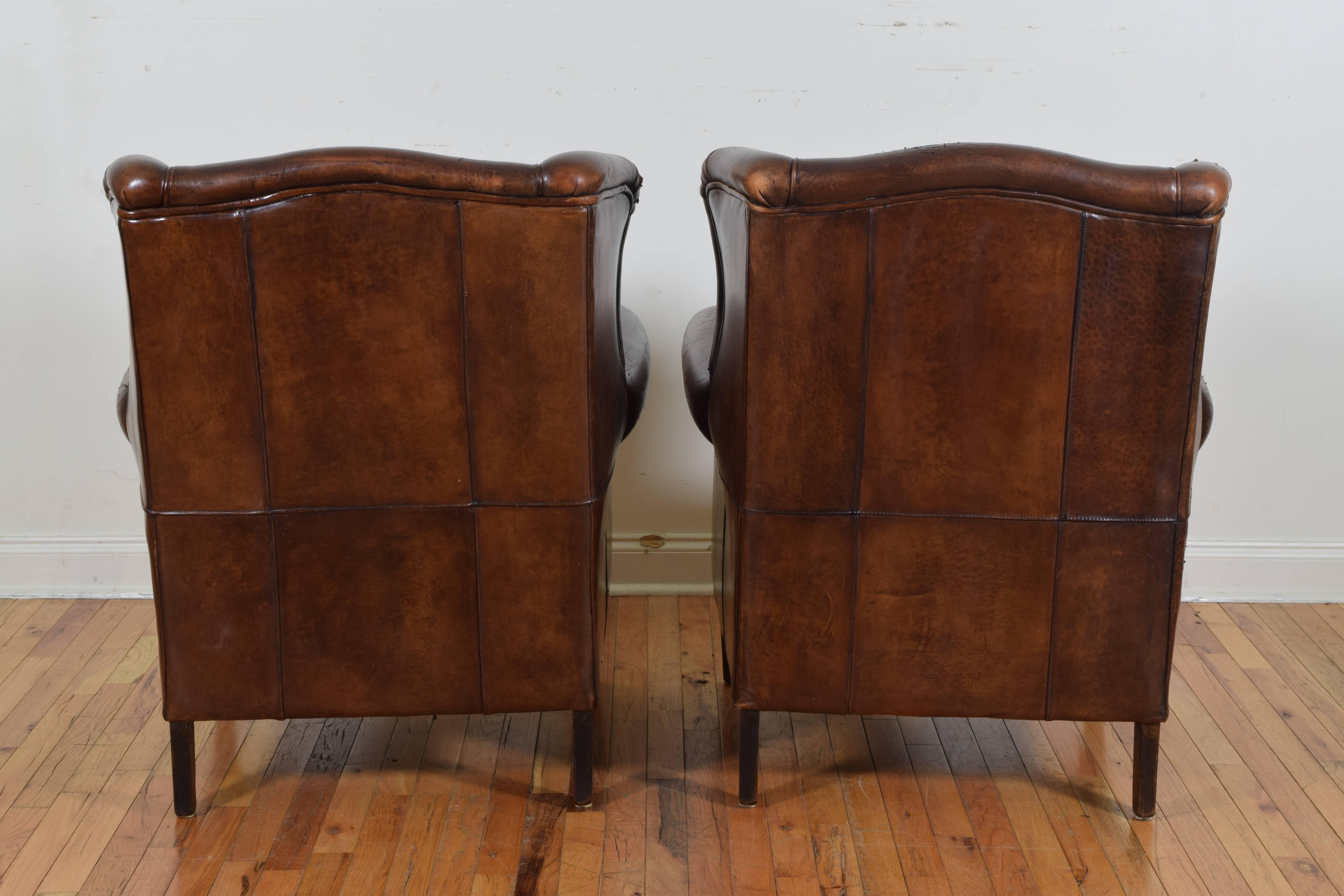 Pair of English Leather Upholstered Wingchairs with Piping, circa 1940s 1