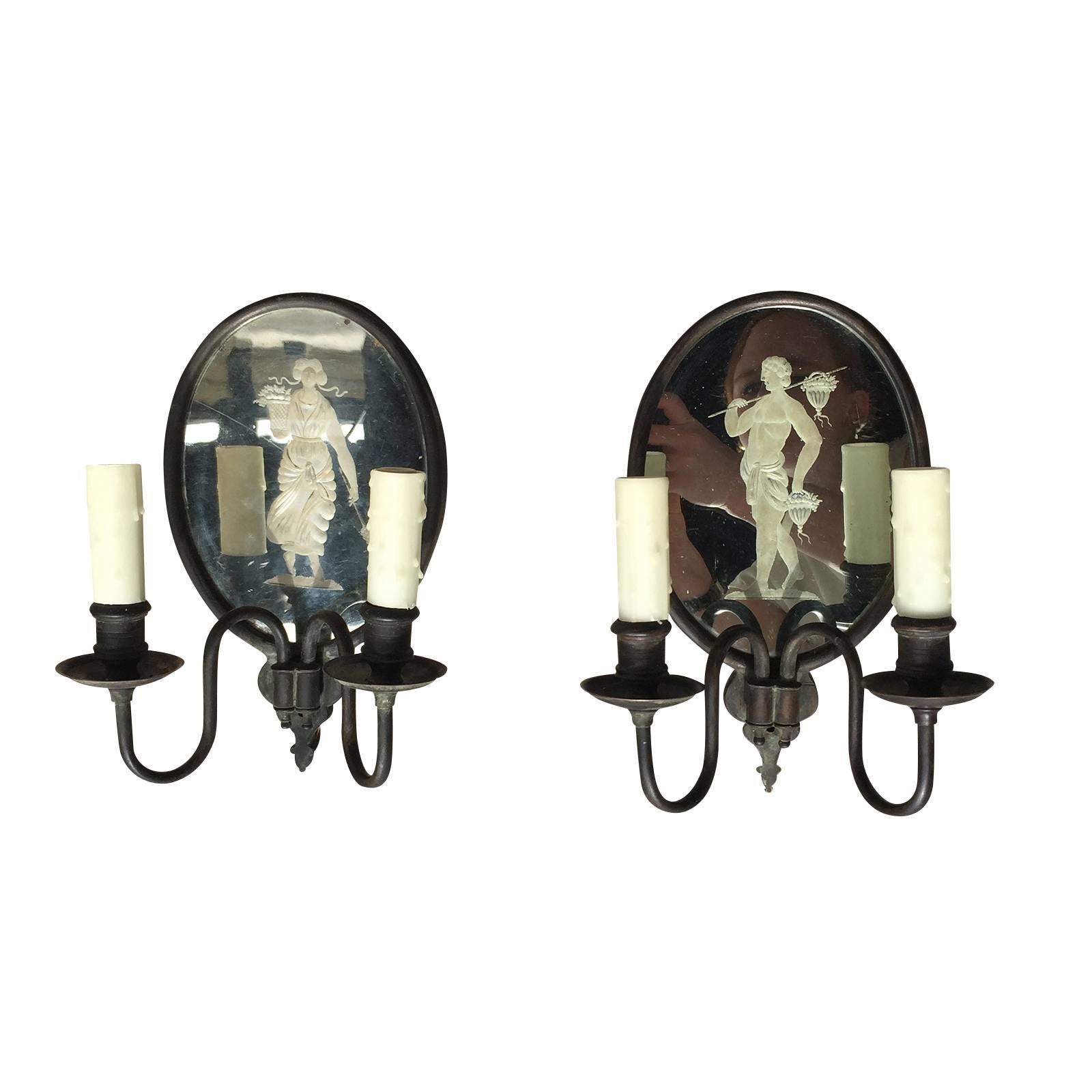 Pair of charming early 20th century two-arm mirrored oval sconces with etchings,
back plate. measures : 6.25