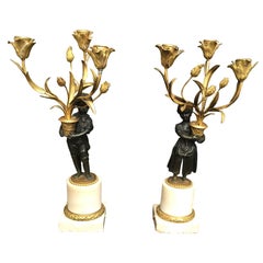 Pair of Continental 19th Century Gilt Bronze Boy and Girl Candelabras