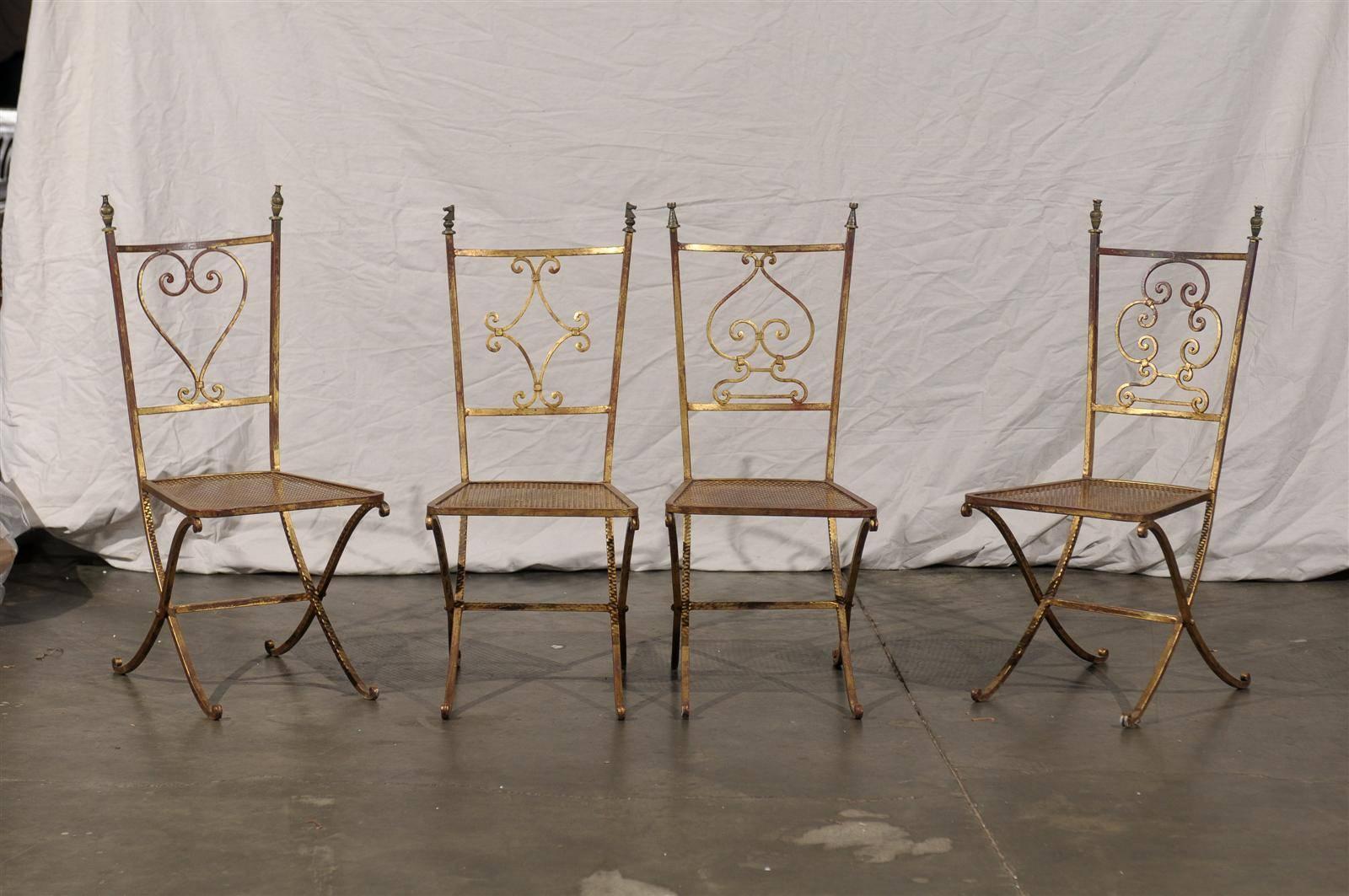 Set of four 20th century French gilt metal chairs, cast bronze chessman finials.
Back splats are heart, diamond, spade and club
Whimsical Mid-20th Century card chairs featuring heart, diamond, spade, and club backs. Great condition
Seat