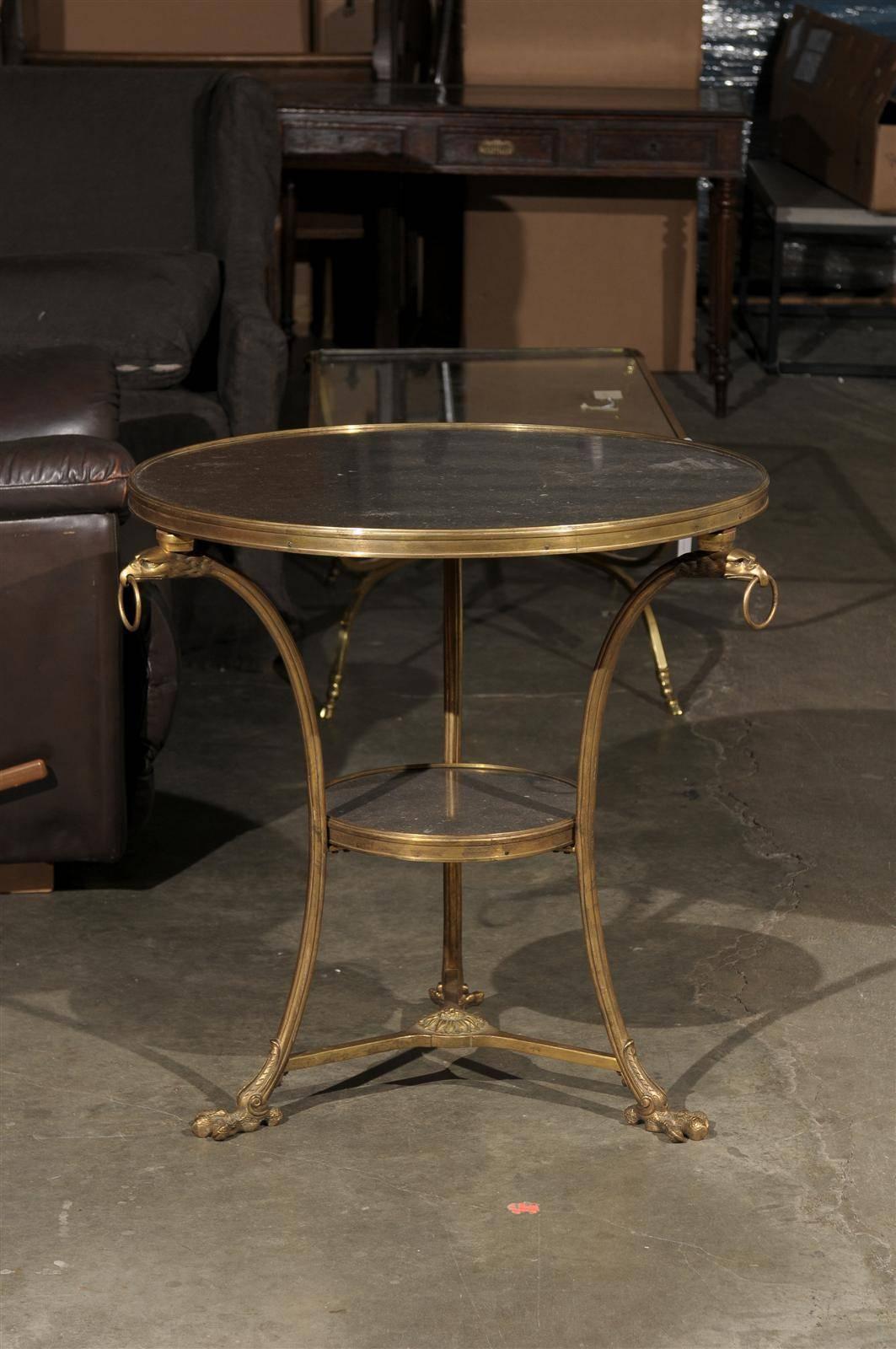 Pair of gilt bronze Continental gueridon table with marble tops.