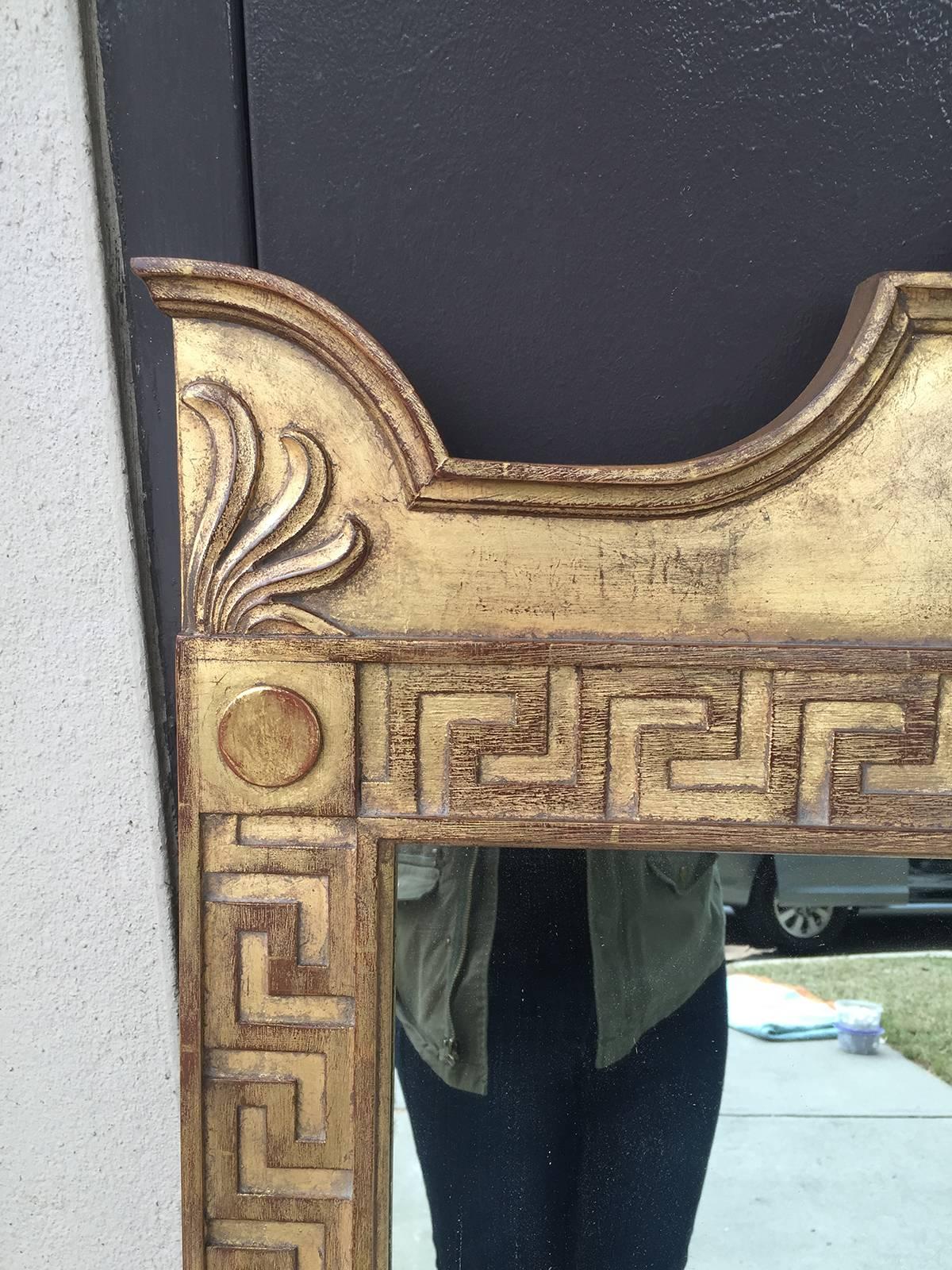 20th century Hollywood Regency style mirror with Greek key, giltwood.