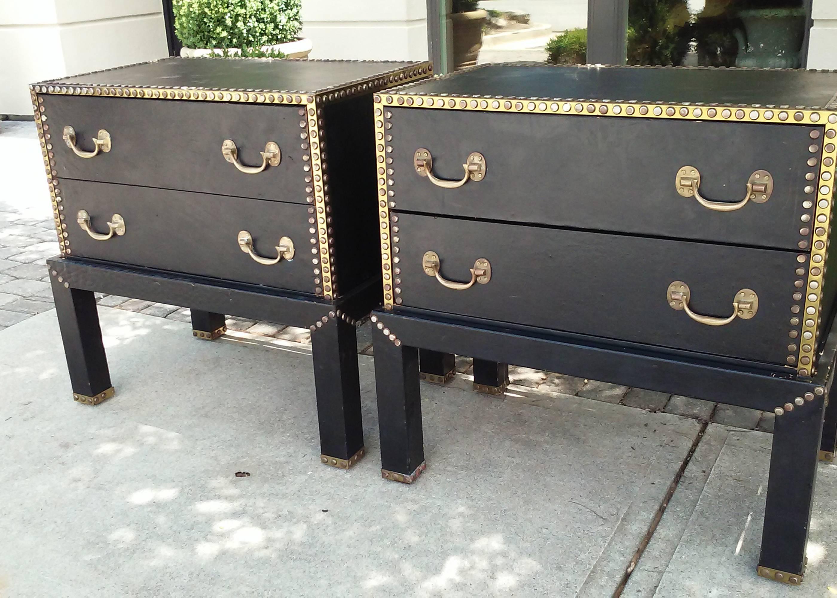 Pair of leather Mid-Century chests with brass studs on stand.