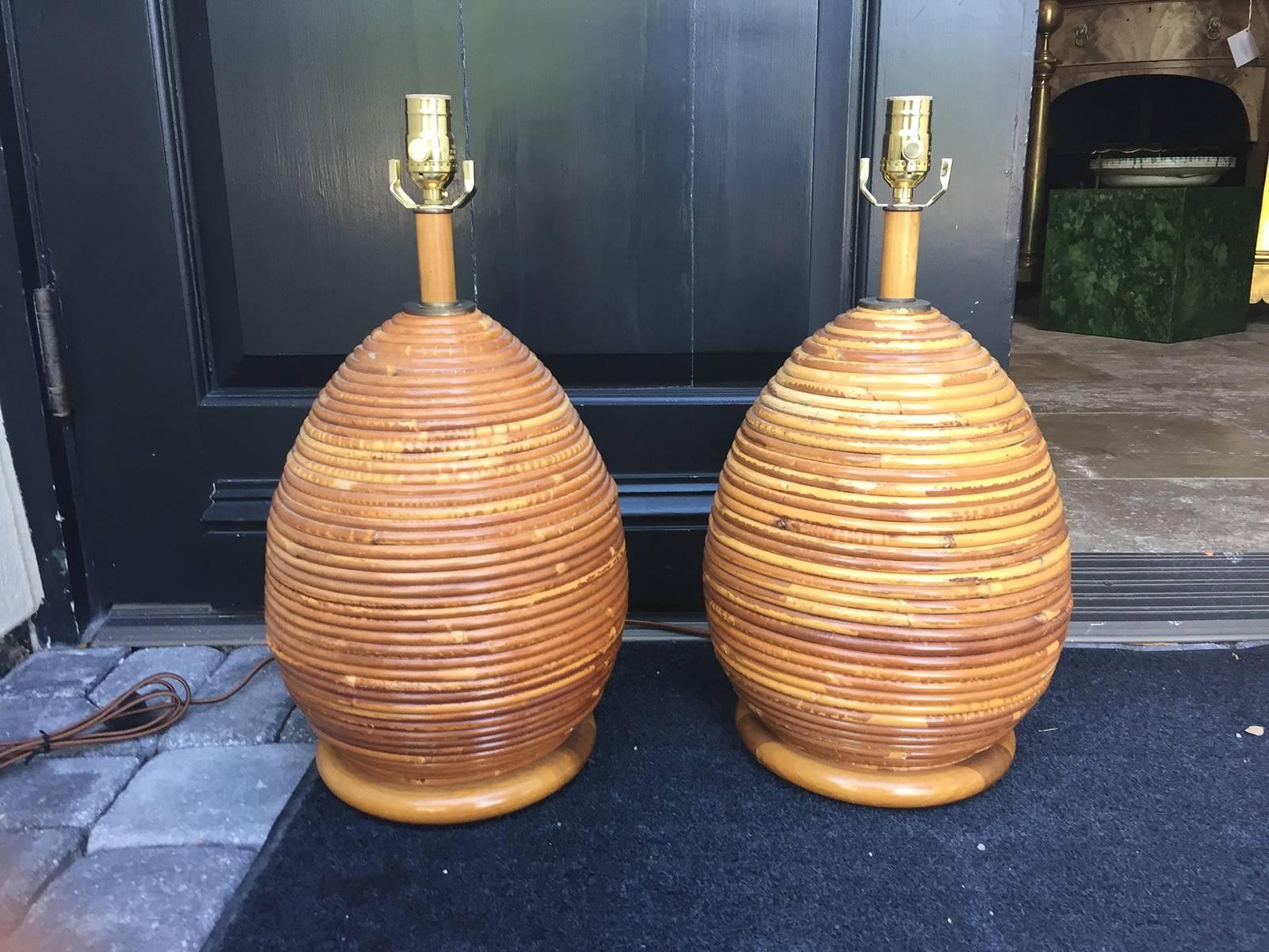 Pair of vintage pencil reed bamboo lamps.
