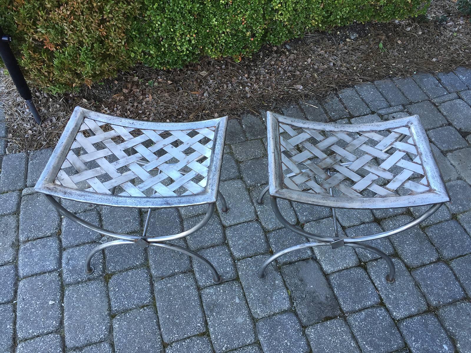 Pair of 1920s polished steel benches.