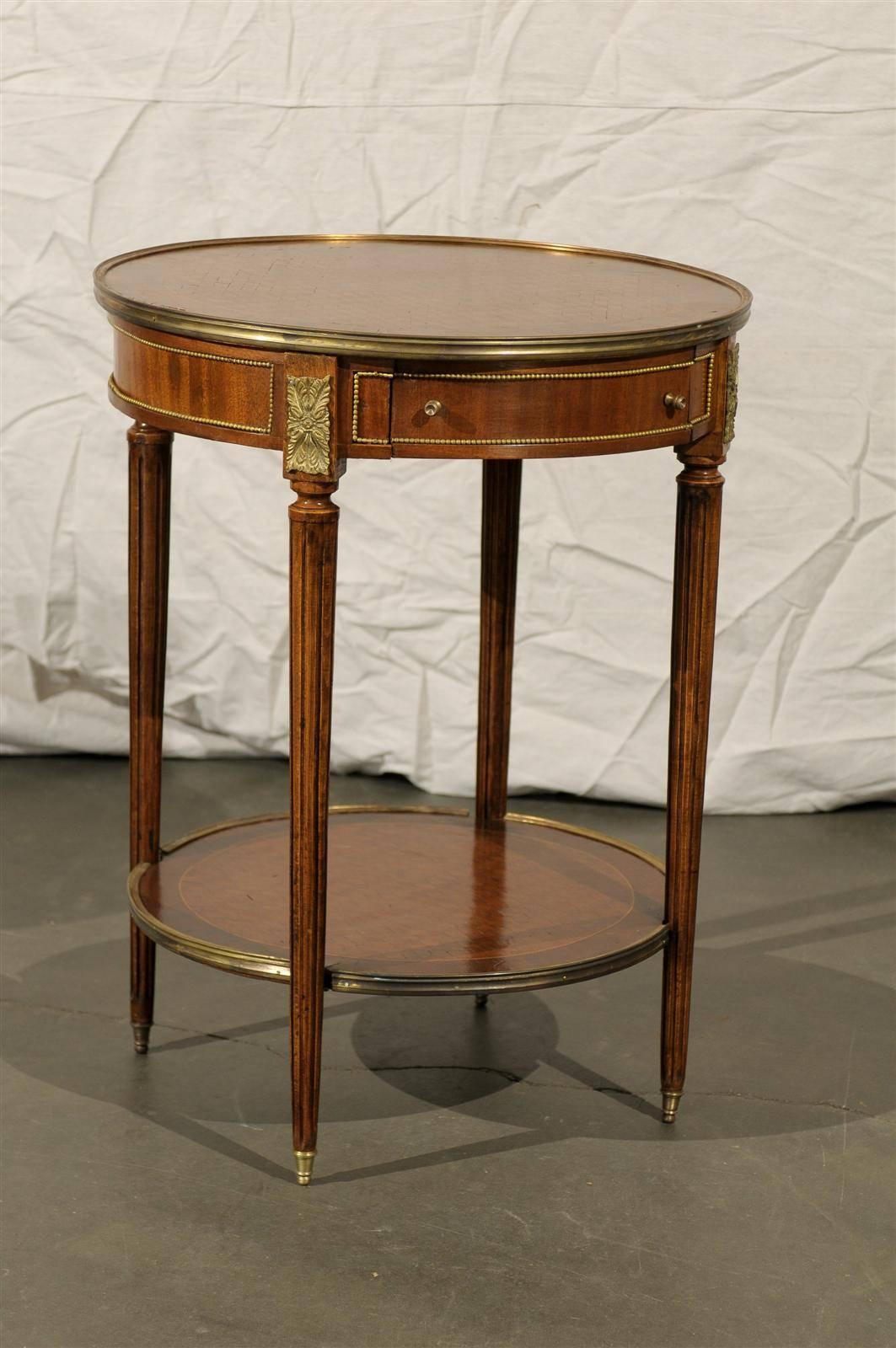 Early 20th century French bronze-mounted inlaid bouilotte table.