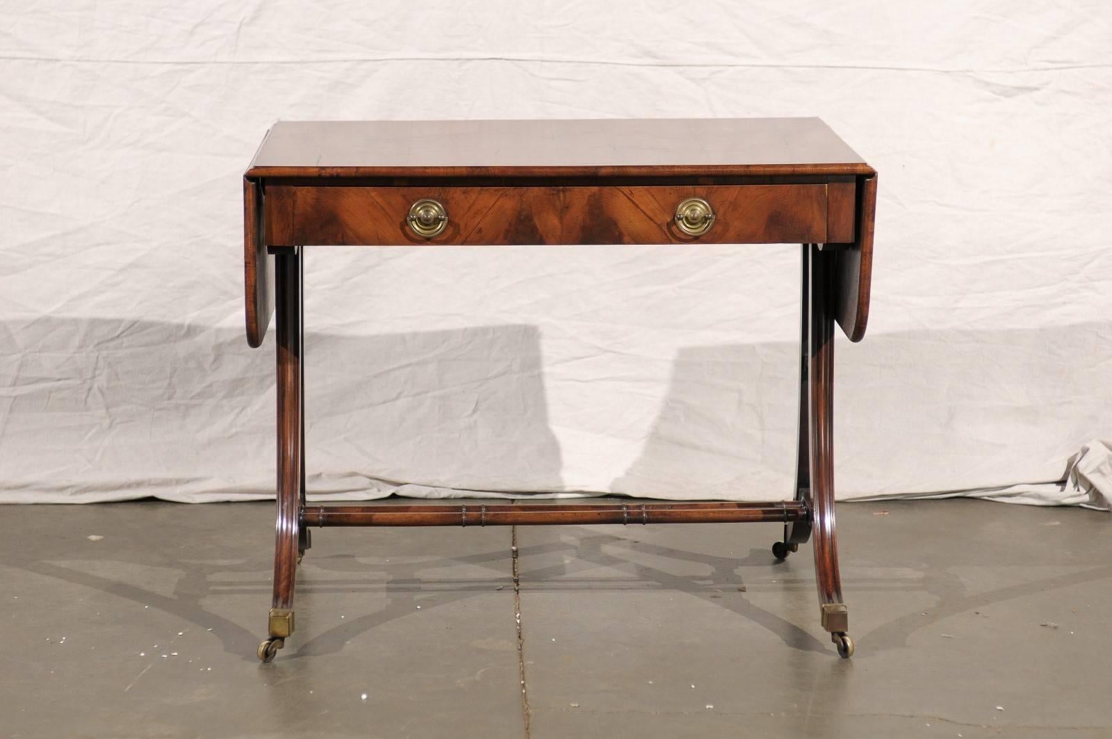 19th century English Regency style burled oyster veneer sofa table. Measures: 45