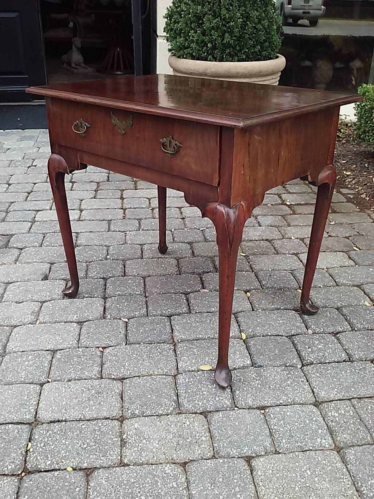18th-19th century English walnut table with single drawer.