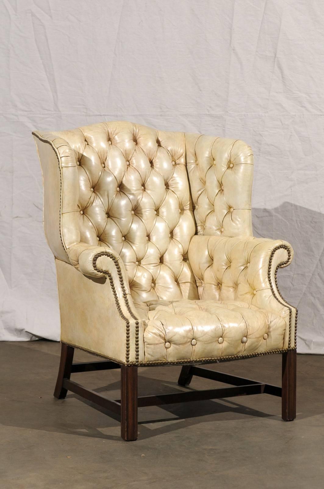 20th century Tufted Georgian style wing chair, white leather.