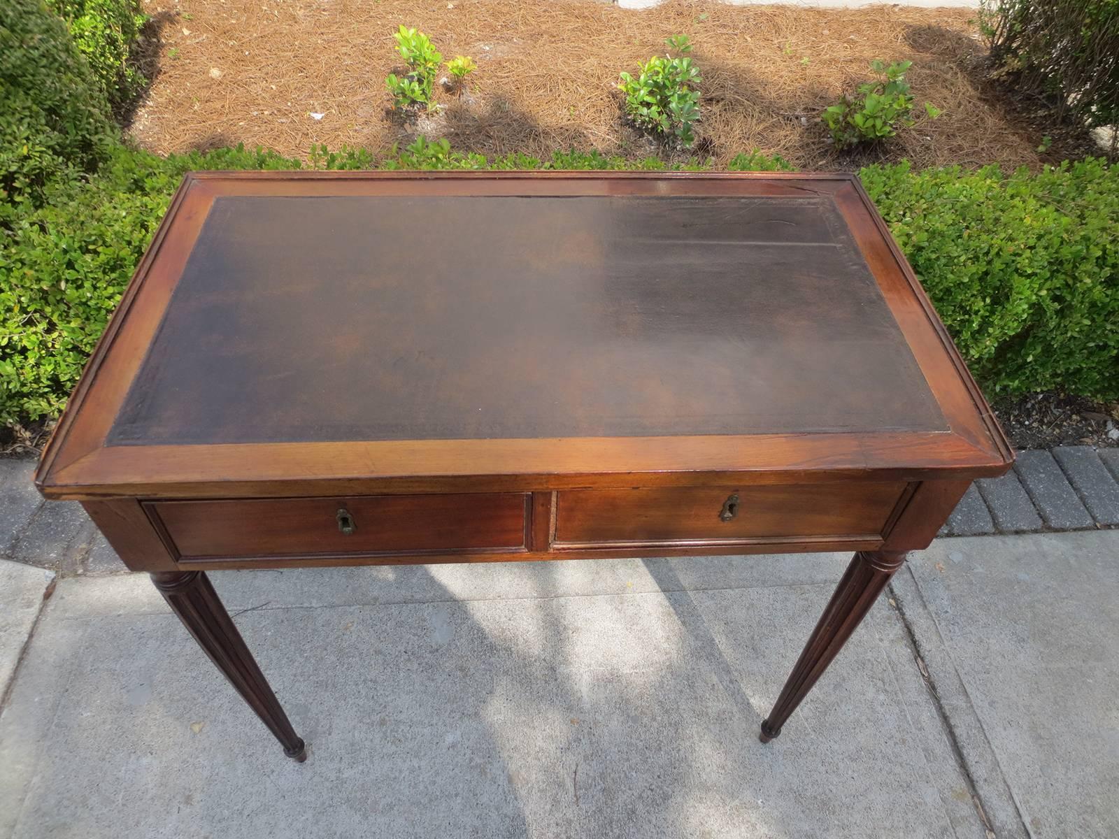 18th-19th century French writing table with leather top.