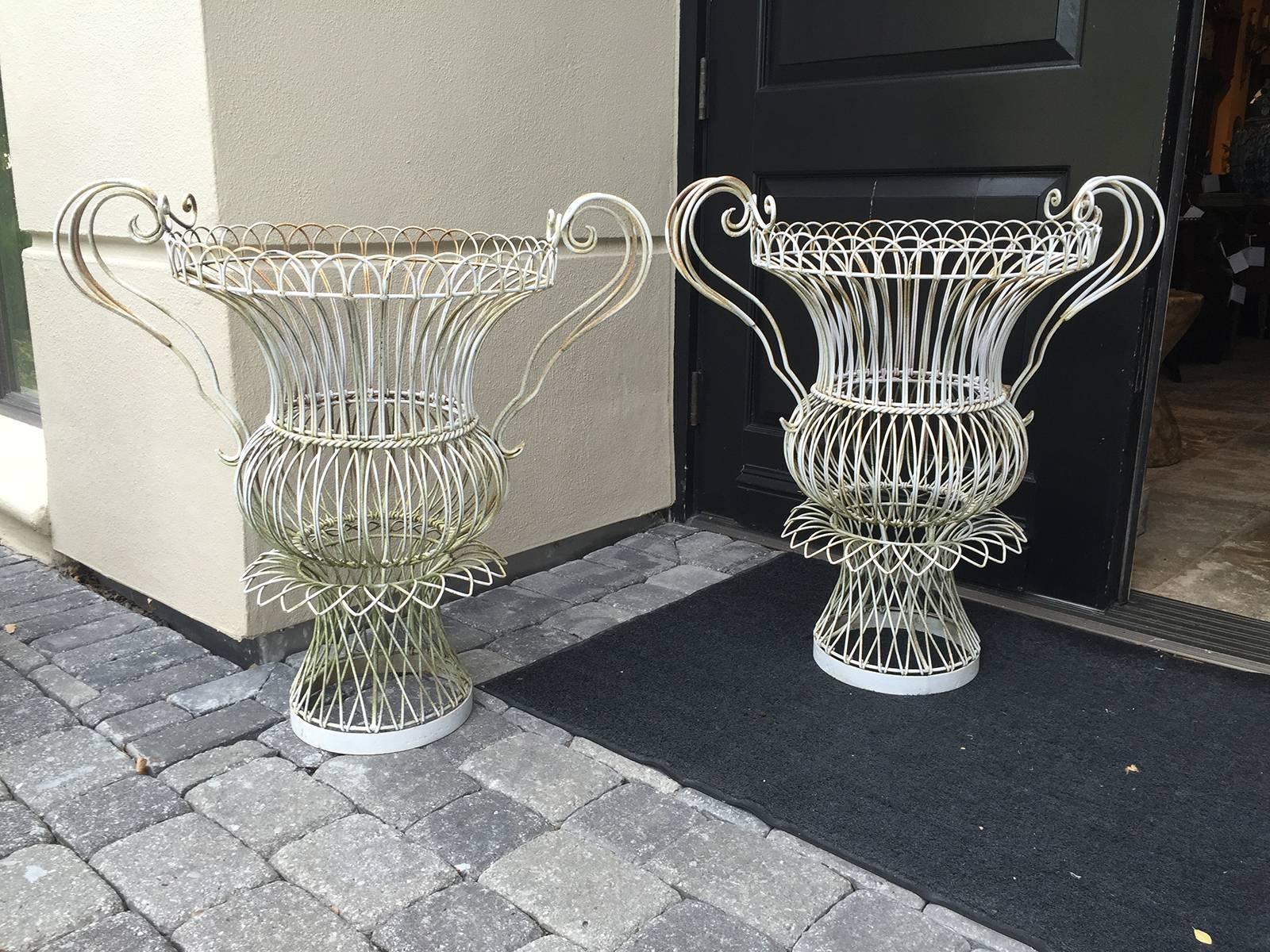 Pair of large 20th century, urn wire baskets.